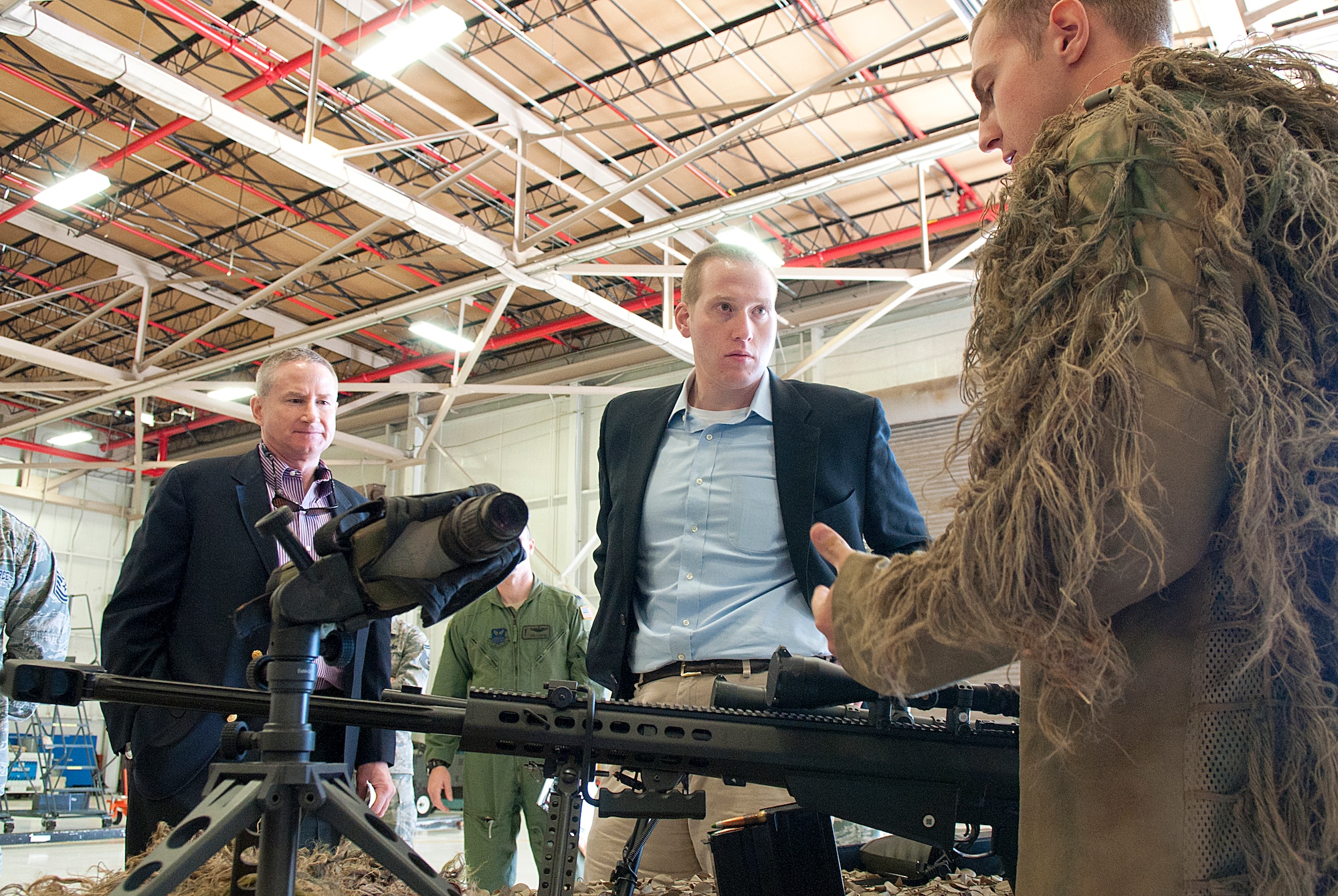Jon Epstein and Dan Lerner, Senate Armed Services Committee staff members, receive a briefing on the tactical response forces’ capabilities by Staff Sgt. Bryan Kovalik, 90th Security Forces Group, during a visit to F. E. Warren Air Force Base, Wyo., May 31. (U.S. Air Force photo by R.J. Oriez)