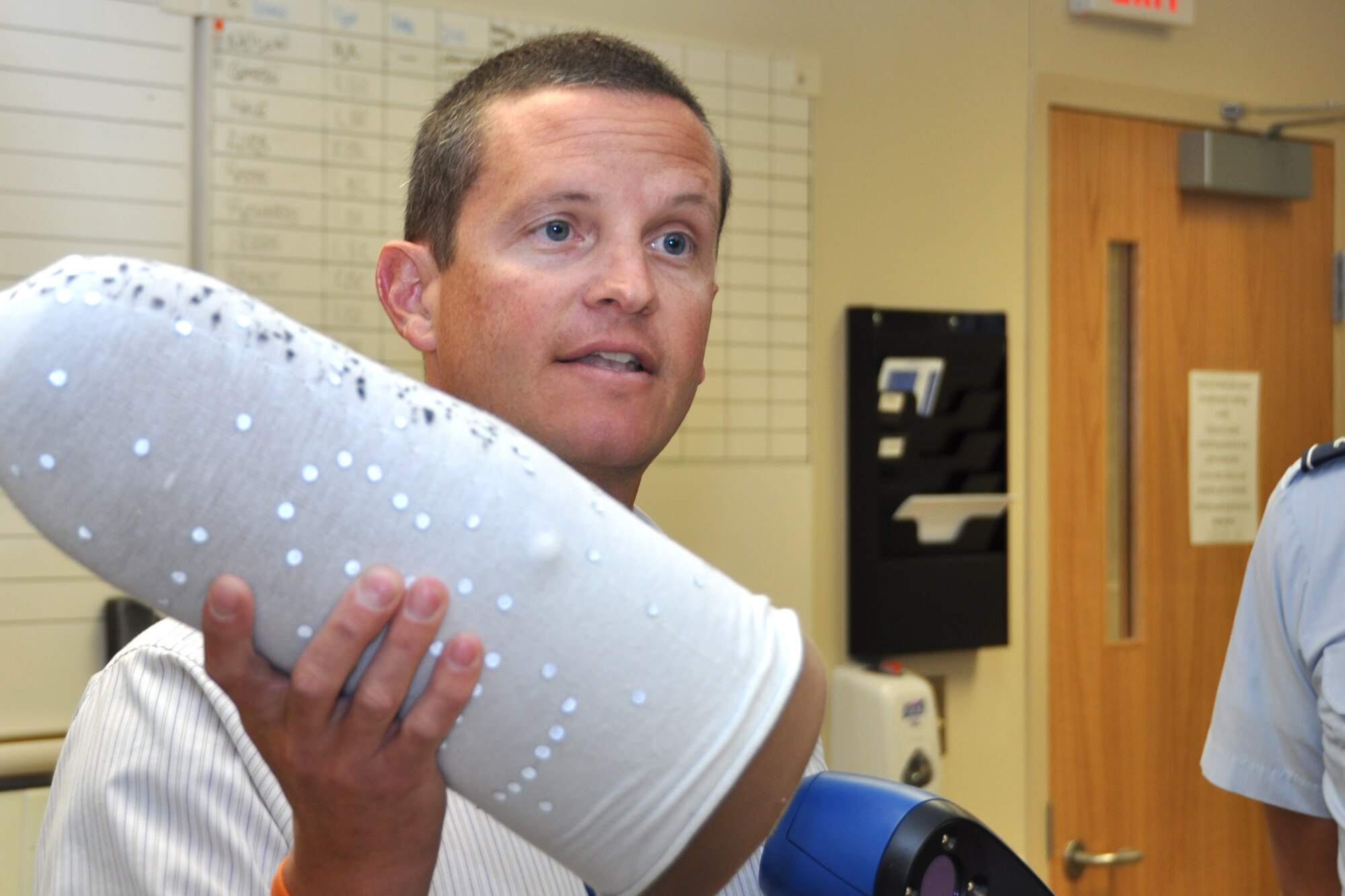 LOUIS STOKES CLEVELAND VA MEDICAL CENTER, Ohio – William Jones, prosthetist with the Prosthetics and Sensory Aids Service, explains the process of developing prosthetics for veteran amputees during the tour at the Louis Stokes Cleveland VA Medical Center June 4, 2012. The Cleveland VA is a multi-specialty outpatient clinic and vet center that includes specialized programs such as blind rehabilitation, polytrauma care, invasive cardiology, post-traumatic stress disorders, comprehensive cancer center and several other areas of expertise. (U.S. Air Force photo by Staff Sgt. Megan Tomkins)