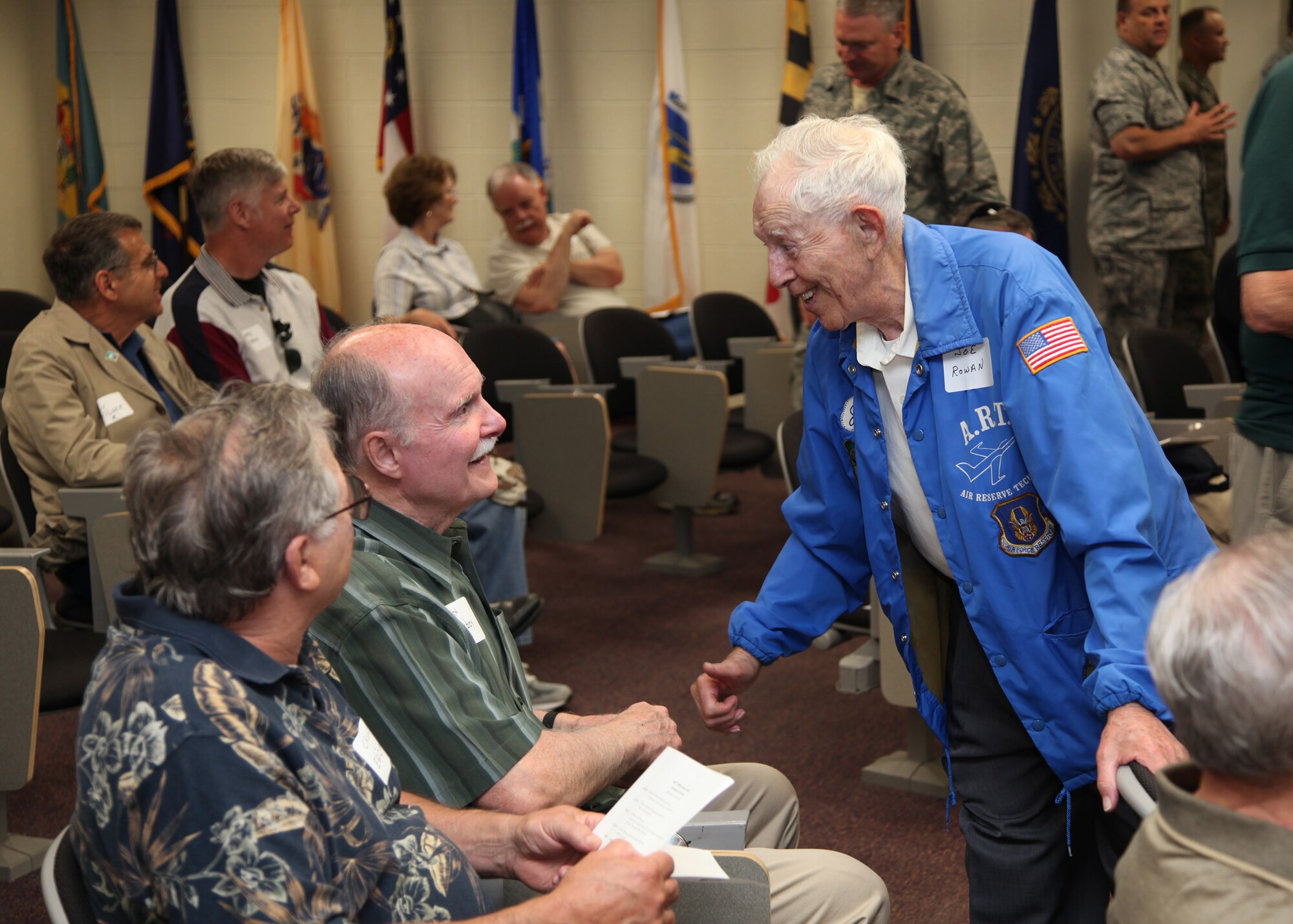 TRAVIS AIR FORCE BASE, Calif. -- Joe Rowen, in blue jacket, speaks with Chuck Egiziano (left) and John Conboy during 349th Alumni Day, June 2, 2012 at Travis Air Force Base, Calif., when current and past members of the 349th Air Mobility Wing reinforced the wing's proud heritage and commitment to excellence.  The day's events included the ribbon cutting ceremony for the Heritage Hall in the Wing Headquarters; a BBQ lunch sponsored by the 349th Chiefs Group, the 349th Officer's Spouses Club and Mr. Stanley Davis; and a static display tour of a C-17 Globemaster III.  The day's festivities cumulated with a banquet featuring remarks by Brig. Gen. Dale R. Baumler, former 349 AMW and 14th Air Force commander; and by Brig. Gen. John C. Flournoy, Jr., current 349 AMW commander; and music by the Band of the Golden West. (U.S. Air Force photo / Lt. Col. Robert Couse-Baker)