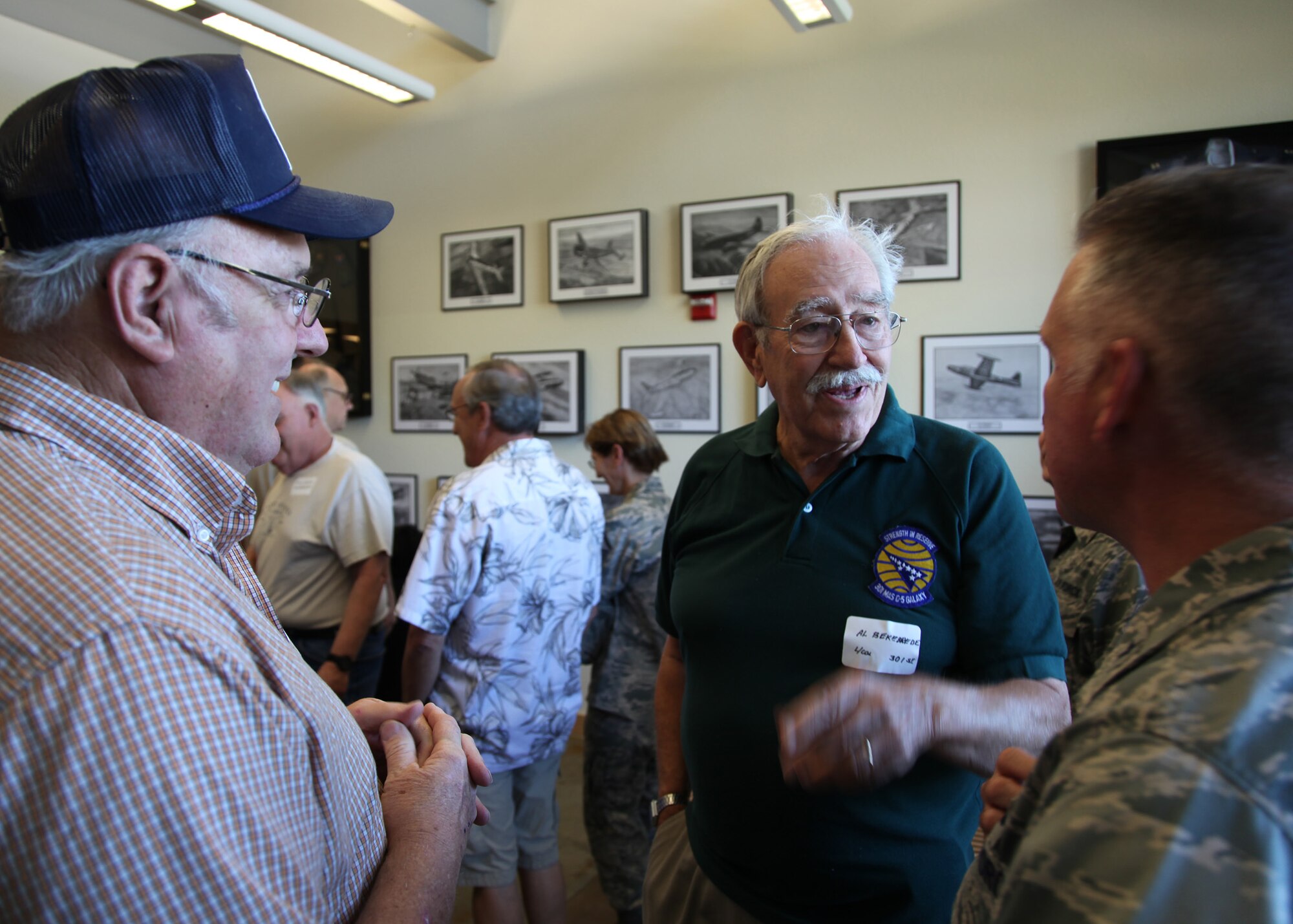TRAVIS AIR FORCE BASE, Calif. -- Current and past members of the 349th Air Mobility Wing admire displays in the Heritage Hall in the Wing Headquarters during Alumni Day, June 2, 2012 at Travis Air Force Base, Calif.  The day's events also included a BBQ lunch sponsored by the 349th Chiefs Group, the 349th Officer's Spouses Club and Mr. Stanley Davis; and a static display tour of a C-17 Globemaster III.  The day's festivities cumulated with a banquet featuring remarks by Brig. Gen. Dale R. Baumler, former 349 AMW and 14th Air Force commander; and by Brig. Gen. John C. Flournoy, Jr., current 349 AMW commander; and music by the Band of the Golden West. (U.S. Air Force photo / Lt. Col. Robert Couse-Baker)