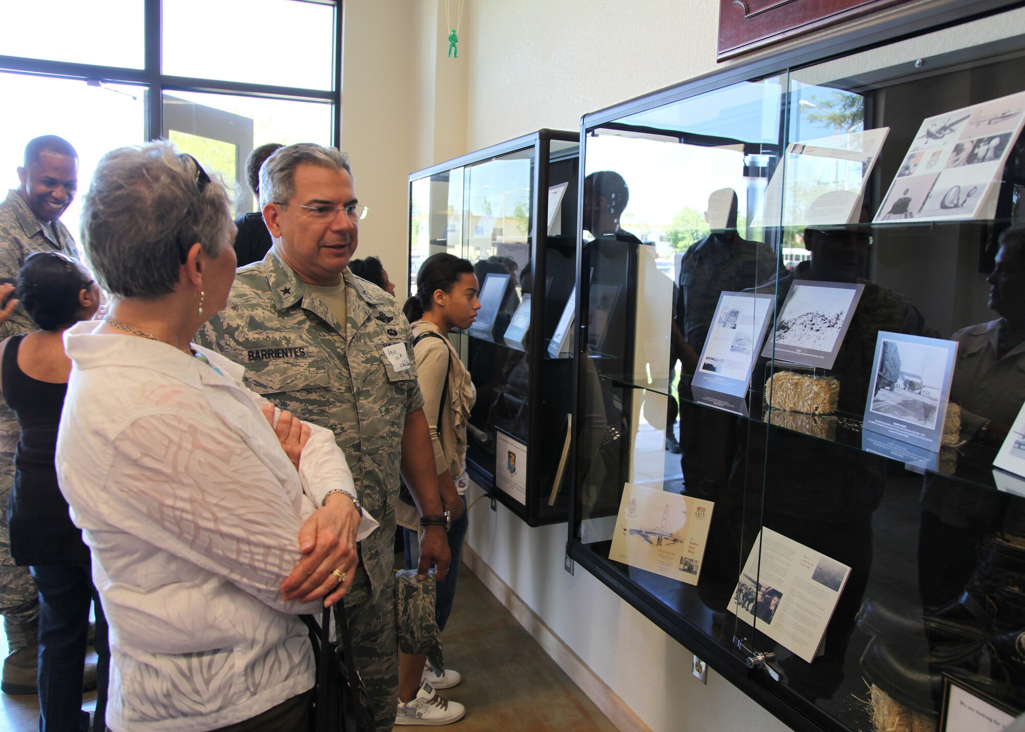 TRAVIS AIR FORCE BASE, Calif. -- Former 349th Air Mobility Wing Vice Commander, Brig. Gen. Abel Barrientes, who was stationed here from 1986-2006, speaks with past members of the 349th Air Mobility Wing and admire displays in the Heritage Hall in the Wing Headquarters during Alumni Day, June 2, 2012 at Travis Air Force Base, Calif.  The day's events also included a BBQ lunch sponsored by the 349th Chiefs Group, the 349th Officer's Spouses Club and Mr. Stanley Davis; and a static display tour of a C-17 Globemaster III.  The day's festivities cumulated with a banquet featuring remarks by Brig. Gen. Dale R. Baumler, former 349 AMW and 14th Air Force commander; and by Brig. Gen. John C. Flournoy, Jr., current 349 AMW commander; and music by the Band of the Golden West. (U.S. Air Force photo / Lt. Col. Robert Couse-Baker)