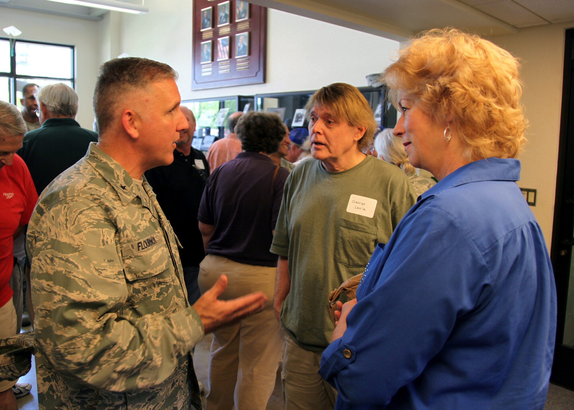 TRAVIS AIR FORCE BASE, Calif. -- Brig. Gen. John C. Flournoy, Jr., 349th Air Mobility Wing Commander, talks with past members and  admire displays in the Heritage Hall in the Wing Headquarters during Alumni Day, June 2, 2012 at Travis Air Force Base, Calif.  The day's events also included a BBQ lunch sponsored by the 349th Chiefs Group, the 349th Officer's Spouses Club and Mr. Stanley Davis; and a static display tour of a C-17 Globemaster III.  The day's festivities cumulated with a banquet featuring remarks by Brig. Gen. Dale R. Baumler, former 349 AMW and 14th Air Force commander; and by Brig. Gen. John C. Flournoy, Jr., current 349 AMW commander; and music by the Band of the Golden West. (U.S. Air Force photo / Lt. Col. Robert Couse-Baker)