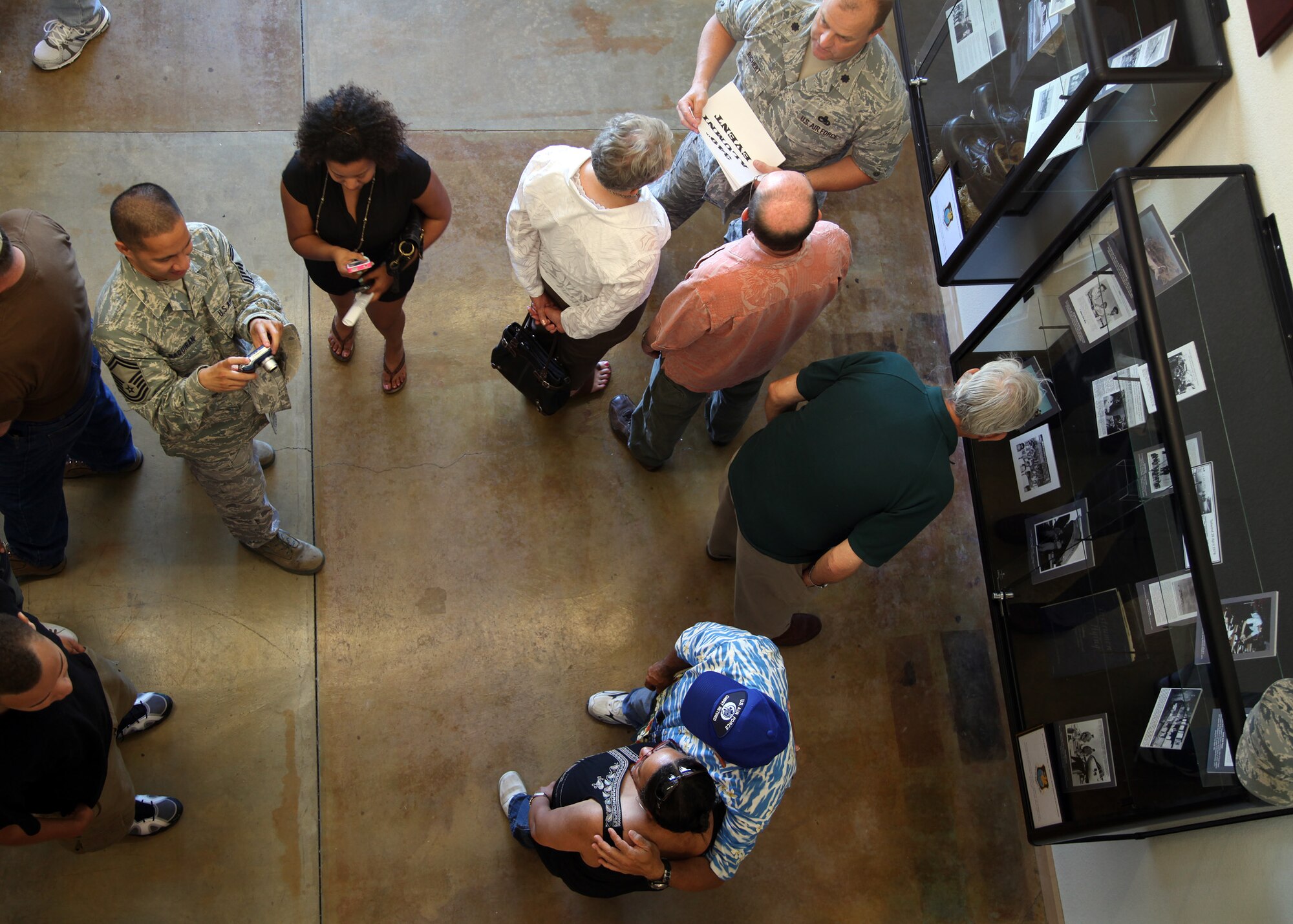 TRAVIS AIR FORCE BASE, Calif. -- Current and past members of the 349th Air Mobility Wing admire displays in the Heritage Hall in the Wing Headquarters during Alumni Day, June 2, 2012 at Travis Air Force Base, Calif.  The day's events also included a BBQ lunch sponsored by the 349th Chiefs Group, the 349th Officer's Spouses Club and Mr. Stanley Davis; and a static display tour of a C-17 Globemaster III.  The day's festivities cumulated with a banquet featuring remarks by Brig. Gen. Dale R. Baumler, former 349 AMW and 14th Air Force commander; and by Brig. Gen. John C. Flournoy, Jr., current 349 AMW commander; and music by the Band of the Golden West. (U.S. Air Force photo / Lt. Col. Robert Couse-Baker)