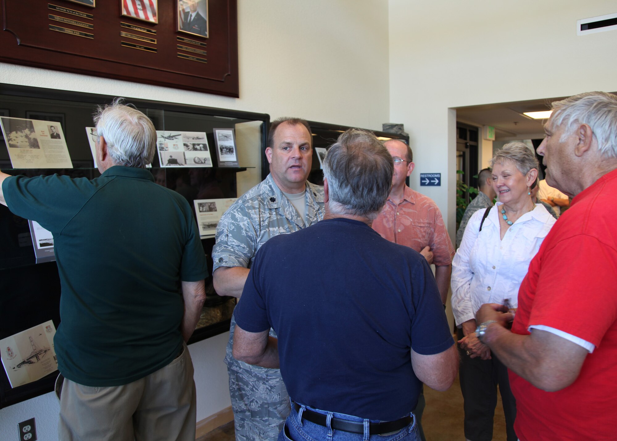 TRAVIS AIR FORCE BASE, Calif. -- Current and past members of the 349th Air Mobility Wing admire displays in the Heritage Hall in the Wing Headquarters during Alumni Day, June 2, 2012 at Travis Air Force Base, Calif.  The day's events also included a BBQ lunch sponsored by the 349th Chiefs Group, the 349th Officer's Spouses Club and Mr. Stanley Davis; and a static display tour of a C-17 Globemaster III.  The day's festivities cumulated with a banquet featuring remarks by Brig. Gen. Dale R. Baumler, former 349 AMW and 14th Air Force commander; and by Brig. Gen. John C. Flournoy, Jr., current 349 AMW commander; and music by the Band of the Golden West. (U.S. Air Force photo / Lt. Col. Robert Couse-Baker)