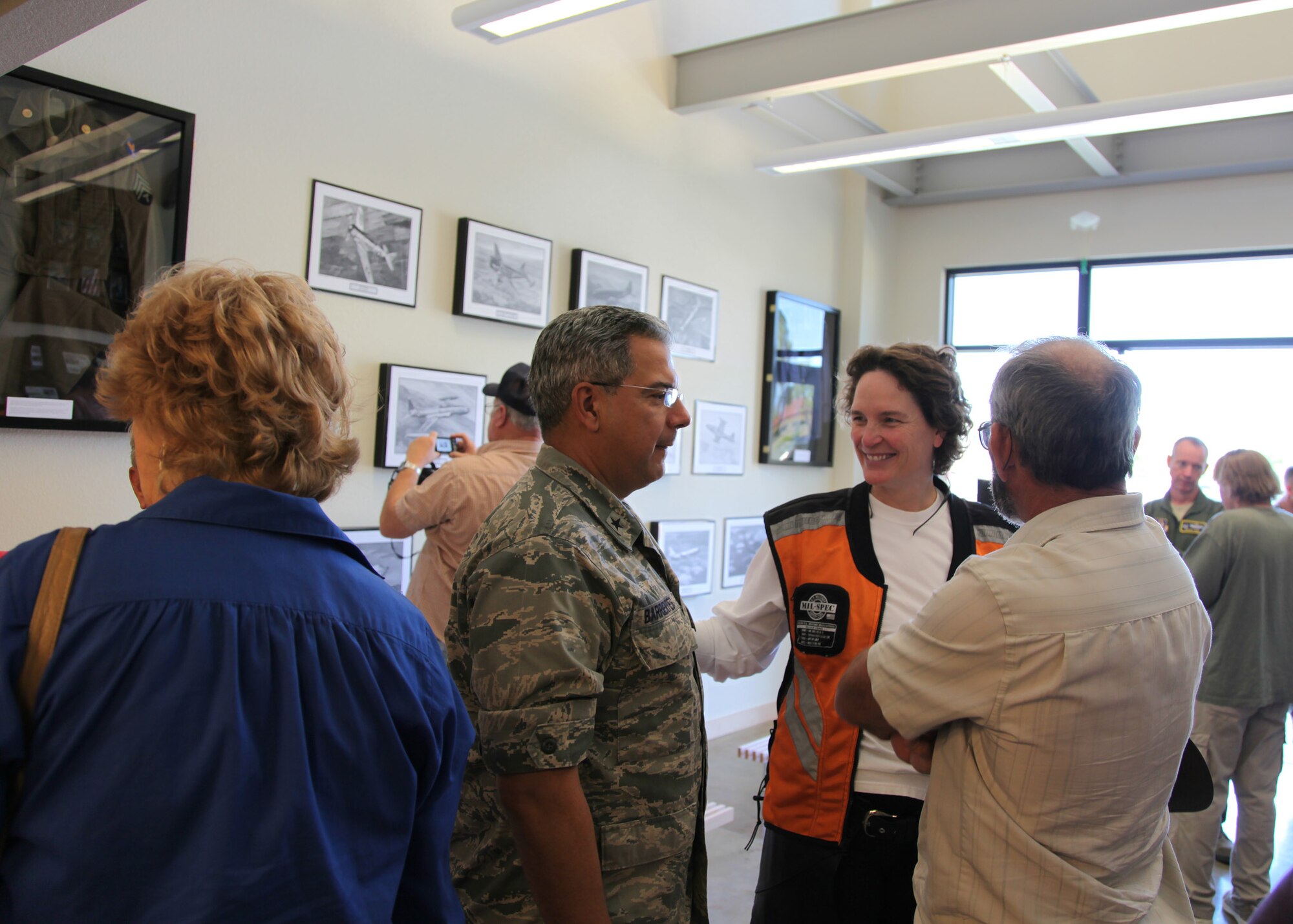 TRAVIS AIR FORCE BASE, Calif. -- Current and past members of the 349th Air Mobility Wing admire displays in the Heritage Hall in the Wing Headquarters during Alumni Day, June 2, 2012 at Travis Air Force Base, Calif.  The day's events also included a BBQ lunch sponsored by the 349th Chiefs Group, the 349th Officer's Spouses Club and Mr. Stanley Davis; and a static display tour of a C-17 Globemaster III.  The day's festivities cumulated with a banquet featuring remarks by Brig. Gen. Dale R. Baumler, former 349 AMW and 14th Air Force commander; and by Brig. Gen. John C. Flournoy, Jr., current 349 AMW commander; and music by the Band of the Golden West. (U.S. Air Force photo / Lt. Col. Robert Couse-Baker)