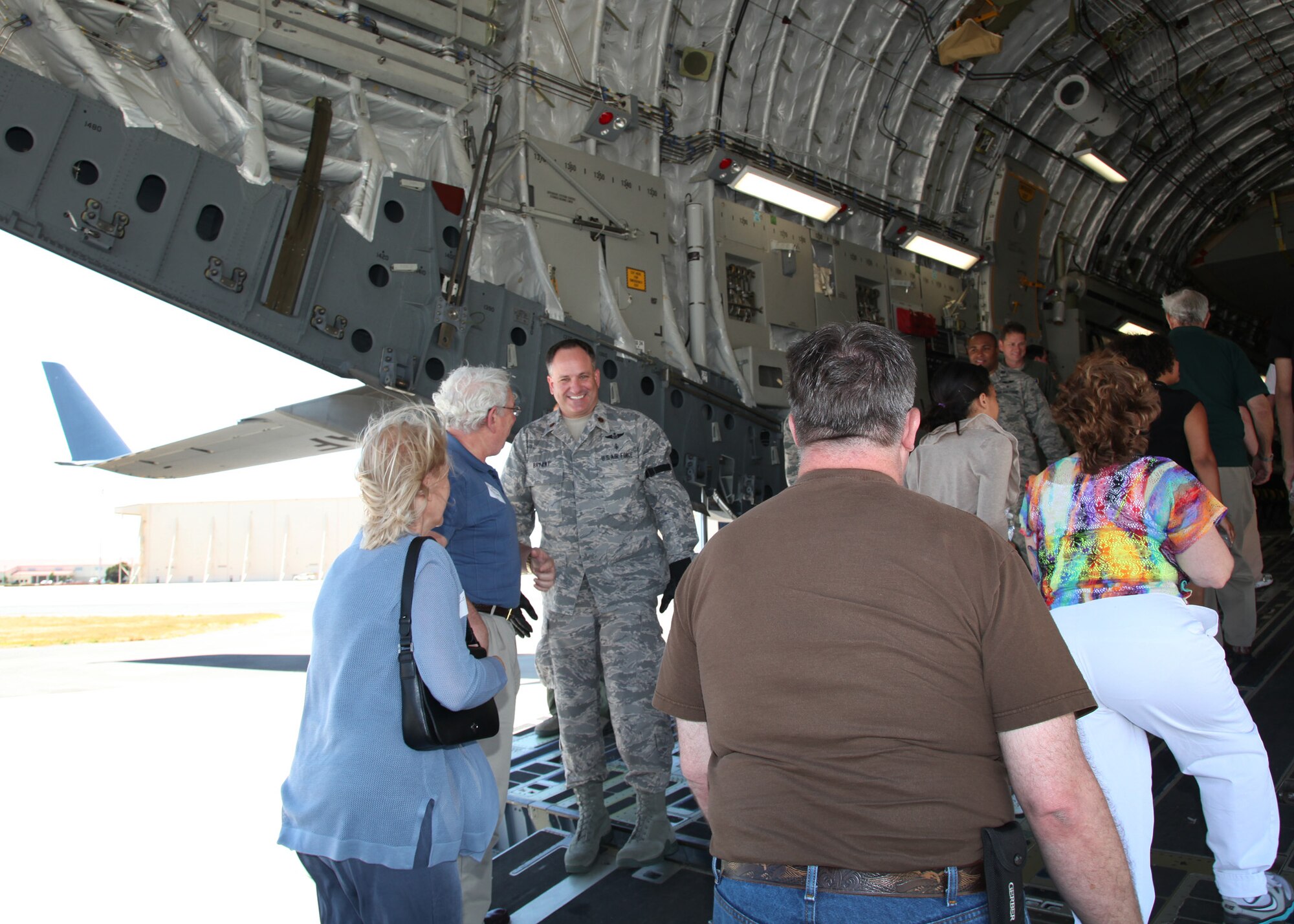 TRAVIS AIR FORCE BASE, Calif. -- Current and past members of the 349th Air Mobility Wing reinforced the wing's proud heritage and commitment to excellence during Alumni Day, June 2, 2012 at Travis Air Force Base, Calif.  The day's events included the ribbon cutting ceremony for the Heritage Hall in the Wing Headquarters; a BBQ lunch sponsored by the 349th Chiefs Group, the 349th Officer's Spouses Club and Mr. Stanley Davis; and a static display tour of a C-17 Globemaster III.  The day's festivities cumulated with a banquet featuring remarks by Brig. Gen. Dale R. Baumler, former 349 AMW and 14th Air Force commander; and by Brig. Gen. John C. Flournoy, Jr., current 349 AMW commander; and music by the Band of the Golden West. (U.S. Air Force photo / Lt. Col. Robert Couse-Baker)