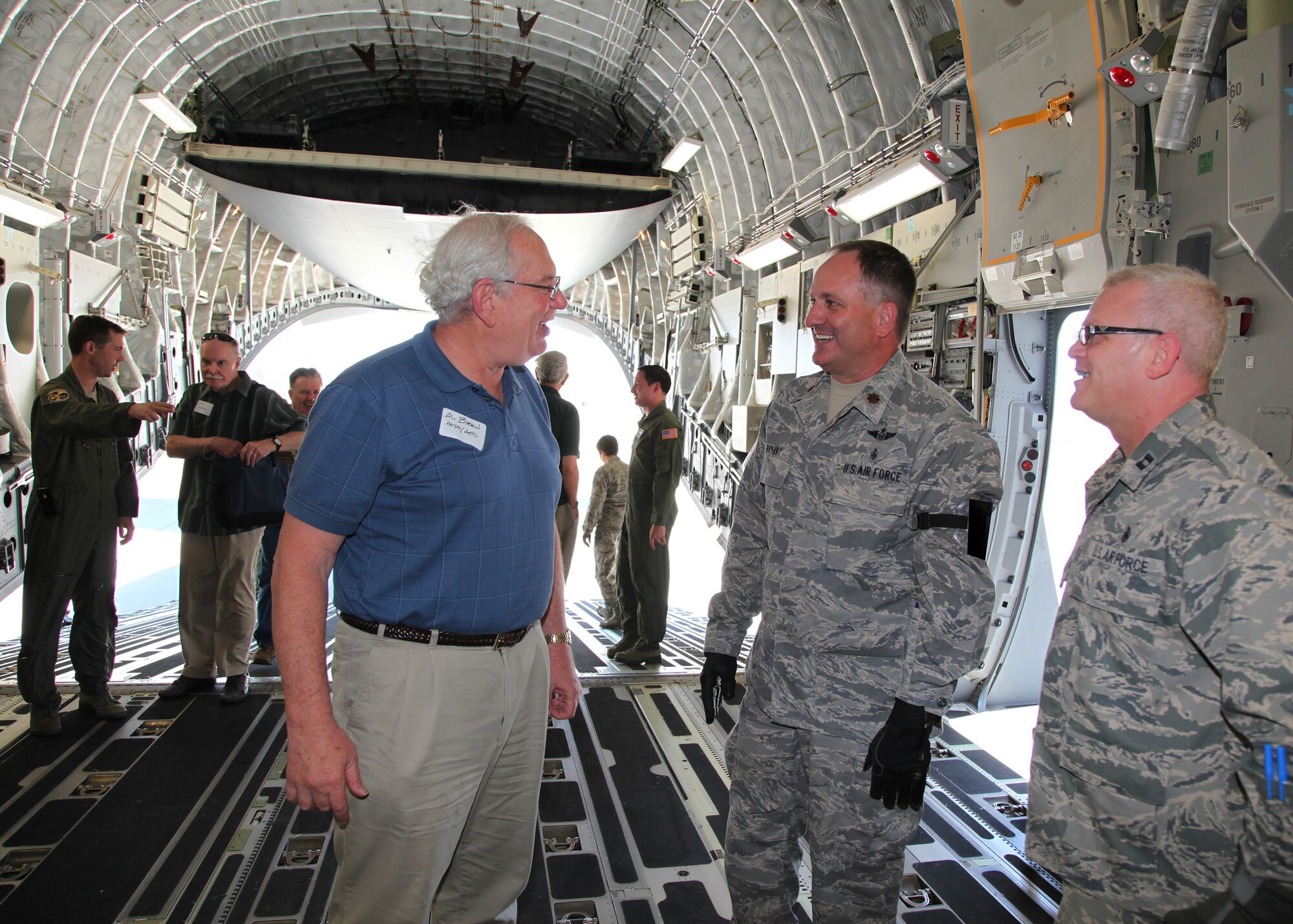 TRAVIS AIR FORCE BASE, Calif. -- Current and past members of the 349th Air Mobility Wing reinforced the wing's proud heritage and commitment to excellence during Alumni Day, June 2, 2012 at Travis Air Force Base, Calif.  The day's events included the ribbon cutting ceremony for the Heritage Hall in the Wing Headquarters; a BBQ lunch sponsored by the 349th Chiefs Group, the 349th Officer's Spouses Club and Mr. Stanley Davis; and a static display tour of a C-17 Globemaster III.  The day's festivities cumulated with a banquet featuring remarks by Brig. Gen. Dale R. Baumler, former 349 AMW and 14th Air Force commander; and by Brig. Gen. John C. Flournoy, Jr., current 349 AMW commander; and music by the Band of the Golden West. (U.S. Air Force photo / Lt. Col. Robert Couse-Baker)