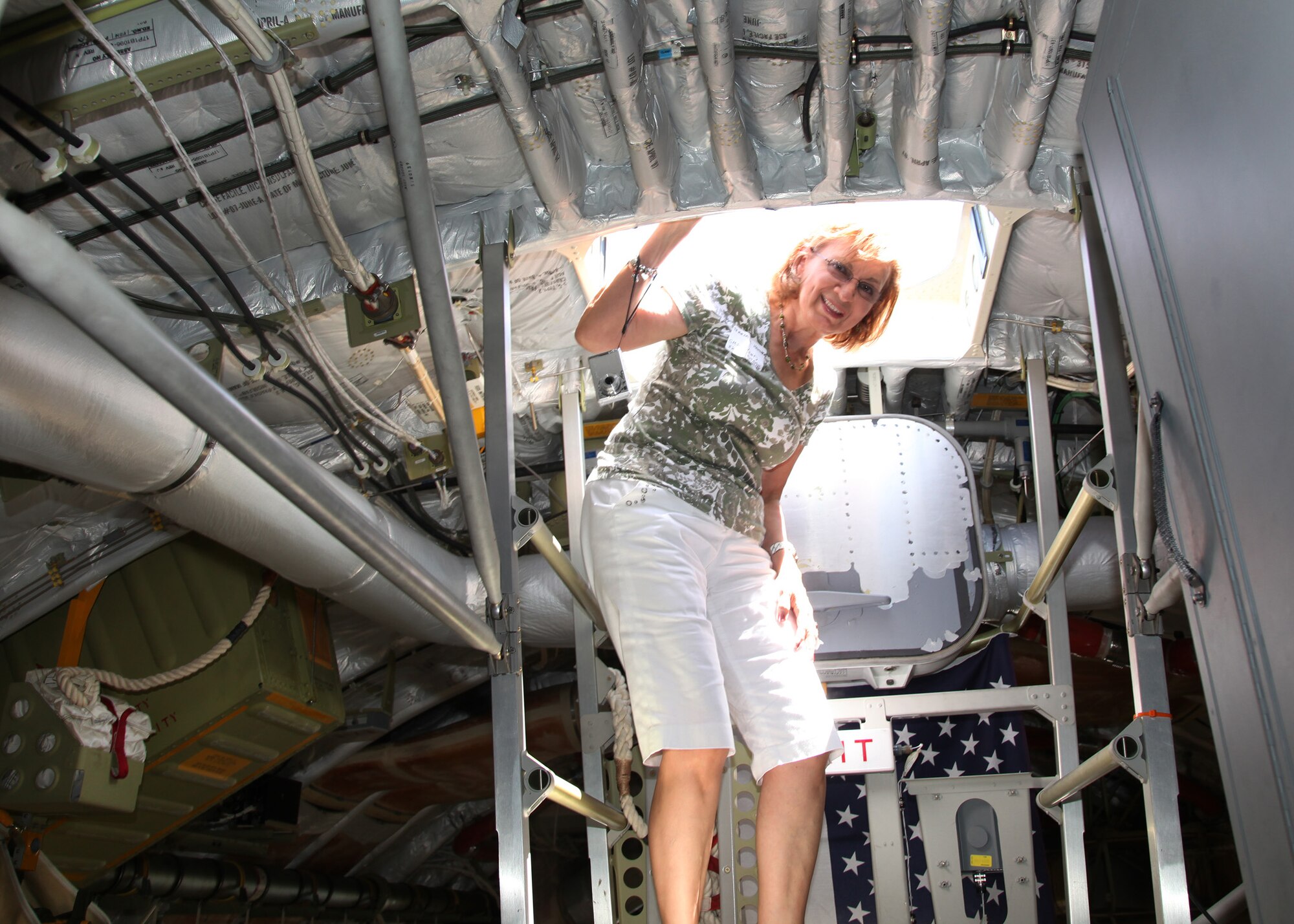 TRAVIS AIR FORCE BASE, Calif. -- During the 349th Air Mobility Wing Alumni Day, Chief Master Sgt. Teresa Hamner (Retired) takes a look out of the top hatch of a C-17 Globemaster III at Travis Air Force Base, Calif., June 2, 2012.  The day's events celebrated the wing's proud heritage and commitment to excellence. (U.S. Air Force photo / Lt. Col. Robert Couse-Baker)