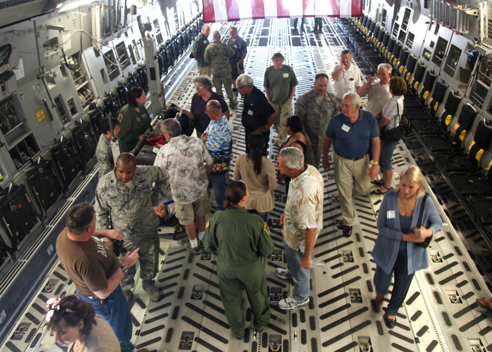 TRAVIS AIR FORCE BASE, Calif. -- Current and past members of the 349th Air Mobility Wing reinforced the wing's proud heritage and commitment to excellence during Alumni Day, June 2, 2012 at Travis Air Force Base, Calif.  The day's events included the ribbon cutting ceremony for the Heritage Hall in the Wing Headquarters; a BBQ lunch sponsored by the 349th Chiefs Group, the 349th Officer's Spouses Club and Mr. Stanley Davis; and a static display tour of a C-17 Globemaster III.  The day's festivities cumulated with a banquet featuring remarks by Brig. Gen. Dale R. Baumler, former 349 AMW and 14th Air Force commander; and by Brig. Gen. John C. Flournoy, Jr., current 349 AMW commander; and music by the Band of the Golden West. (U.S. Air Force photo / Lt. Col. Robert Couse-Baker)