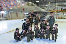 Kids and pilots from the 388th Fighter Wing gather May 25 at an event organized by the 421st Fighter Squadron and the Make-A-Wish Foundation to let children learn what it’s like to be a fighter pilot at Hill Air Force Base. (U.S. Air Force photo by Kim Cook/Released)