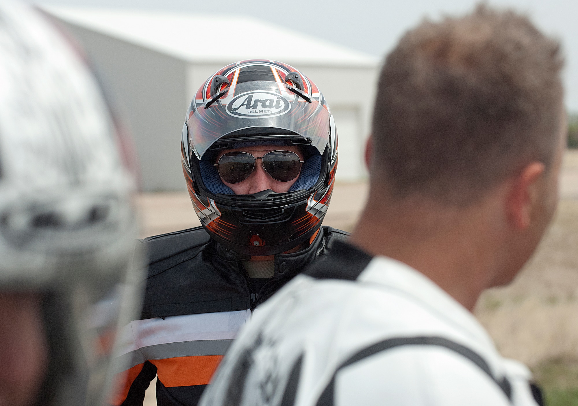 Senior Airman Timothy Jesse, 90th Medical Operations Squadron, listens to instructor Tech. Sgt. Christopher Laubin, 90th Operations Group, explain an exercise during the field portion of the first Military Sportbike Rider Course offered by the 90th Missile Wing traffic safety office May 30 at F. E. Warren Air Force Base, Wyo. (U.S. Air Force photo by R.J. Oriez)