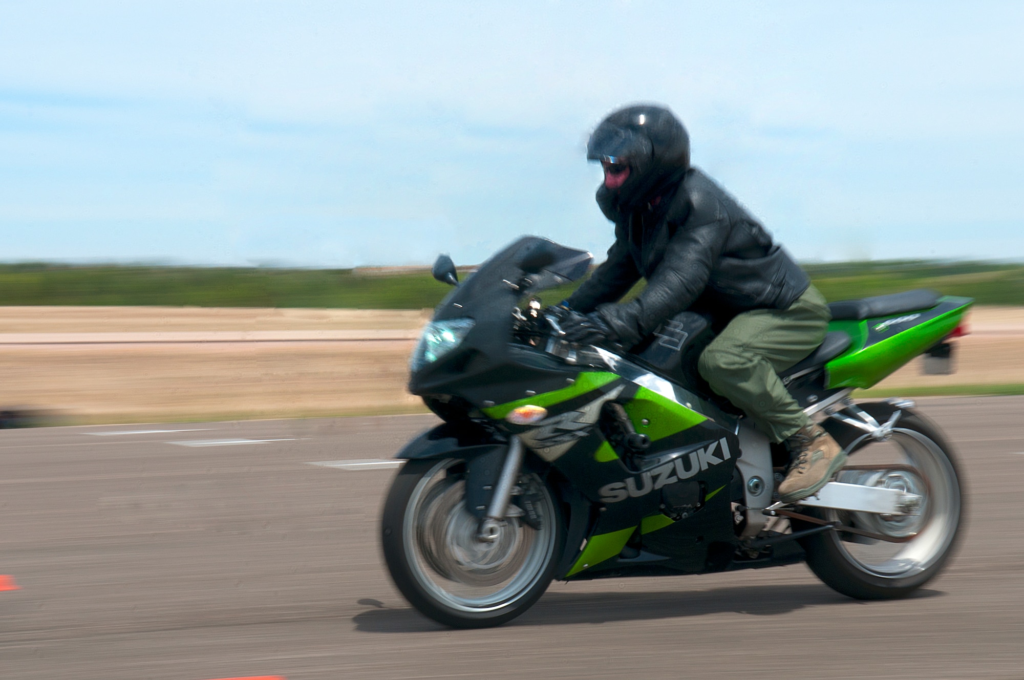 First Lt. Philip Duddles speeds down the course as part of an exercise during the first Military Sportbike Rider Course offered by the 90th Missile Wing traffic safety office May 30 at F. E. Warren Air Force Base, Wyo. (U.S. Air Force photo by R.J. Oriez)