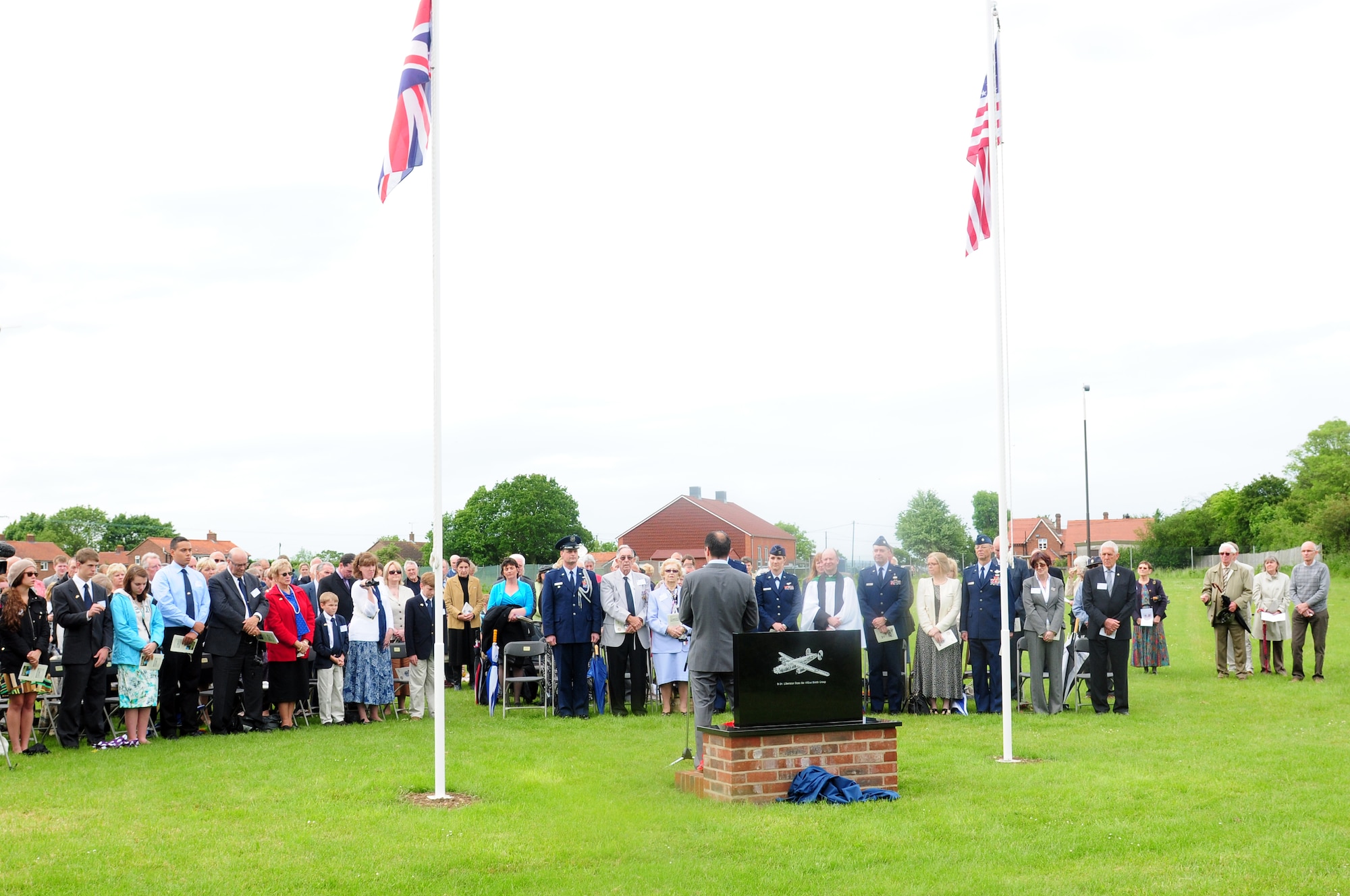GARVESTON, England – Members from the U.S. Air Force, Royal Air Force and locals from the surrounding area gather for the unveiling of the Garveston Memorial June 6, 2012.  On June 4, 1944 an Army Air Corps B-24 Liberator Bomber crashed near the village, killing 10 crew members and two firemen. The memorial was dedicated by a committee formed by those who witnessed the crash over 60 years ago. (U.S. Air Force photo by Airman 1st Class Cory D. Payne)