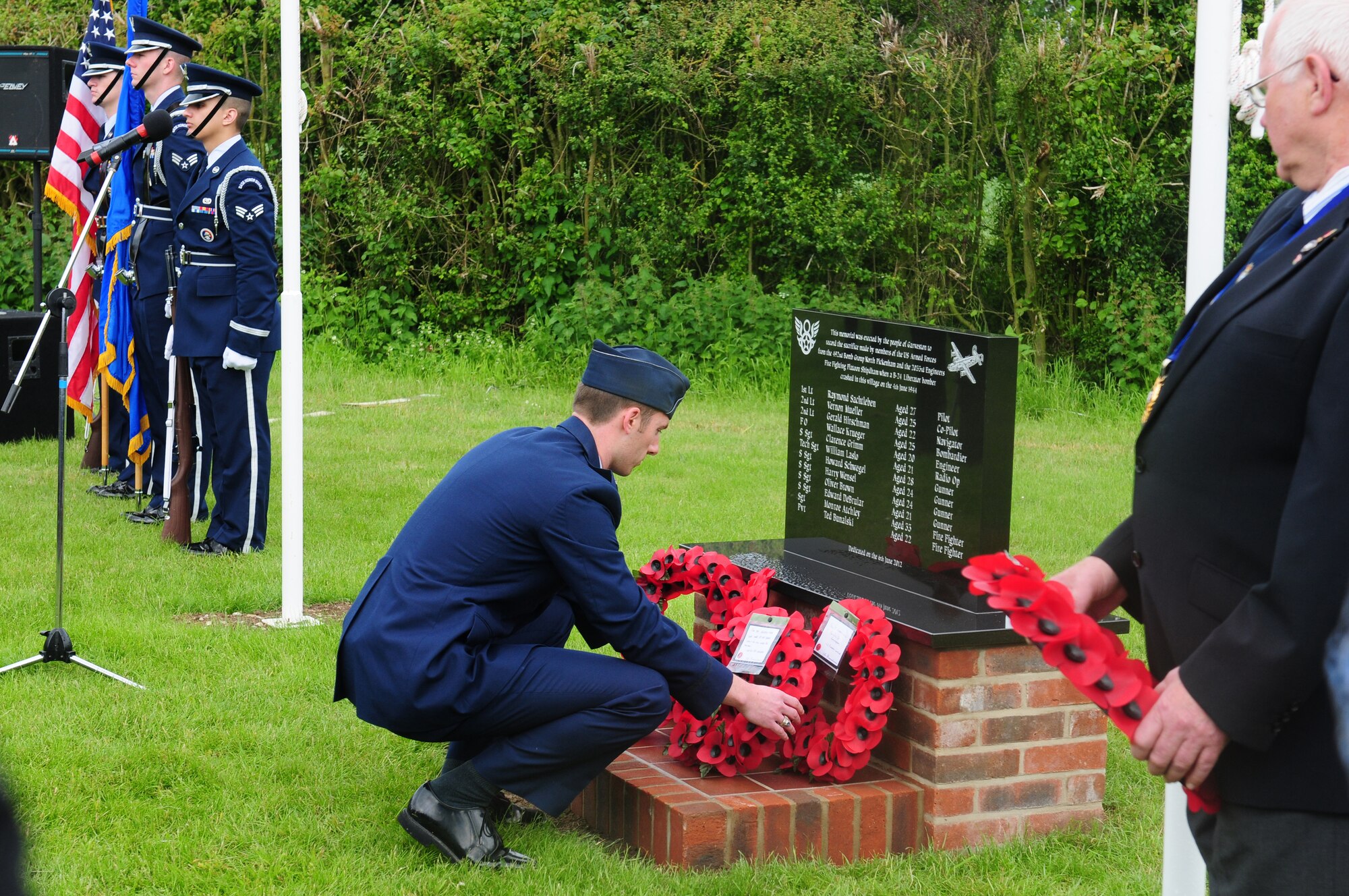 GARVESTON, England – Capt. Brent Peterson, 492nd Fighter Squadron pilot, lays a wreath on the recently unveiled Garveston Memorial June 6, 2012.  On June 4, 1944 an Army Air Corps B-24 Liberator Bomber crashed near the village, killing 10 crew members and two firemen. The memorial was dedicated by a committee formed by those who witnessed the crash over 60 years ago. (U.S. Air Force photo by Airman 1st Class Cory D. Payne)