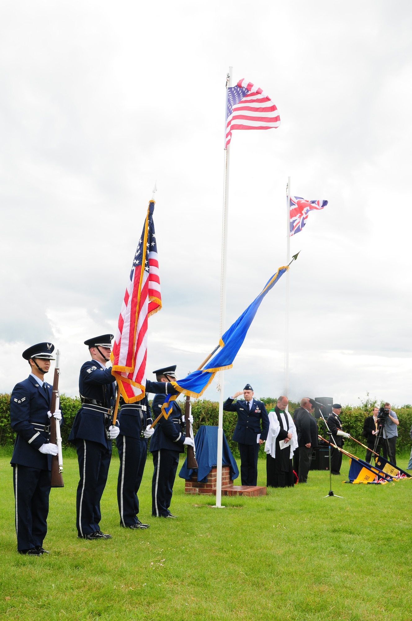 GARVESTON, England – Members of the 48th Fighter Wing Honor Guard present the colors during a memorial in Garveston June 6, 2012.  On June 4, 1944 an Army Air Corps B-24 Liberator Bomber crashed near the village, killing 10 crew members and two firemen. The memorial was dedicated by a committee formed by those who witnessed the crash over 60 years ago. (U.S. Air Force photo by Airman 1st Class Cory D. Payne)