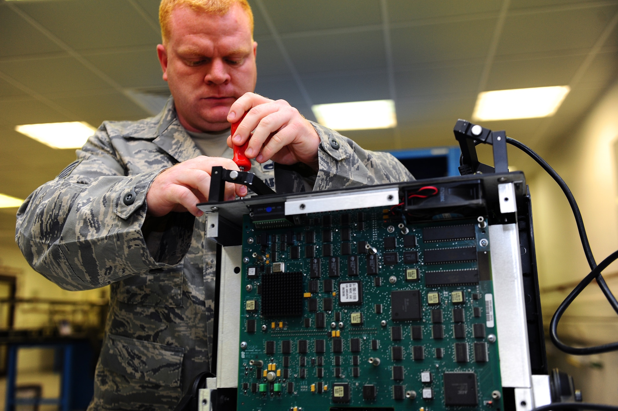 Staff Sgt. Michael Gist, 86th Maintenance Squadron Test Measurement and Diagnostic Equipment technician, troubleshoots a 6000A Communications Analyzer on Ramstein Air Base, Germany, June 5, 2012. The analyzer performs traditional bit error analysis, frame and cell generation, along with signal, performance and timing measurements. The laboratory currently supports 13,842 items in their area of responsibility and on average, calibrates, troubleshoots, and repairs more than 1,000 items monthly. (U.S. Air Force photo/Brea Miller)