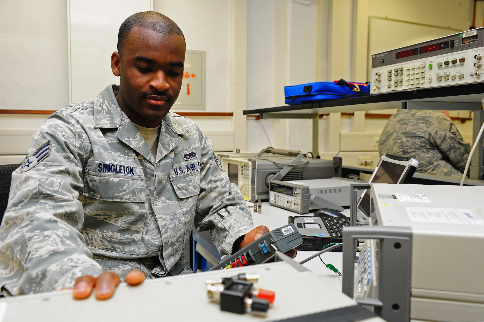 Senior Airman Terrell Singleton, 86th Maintenance SquadronTest Measurement and Diagnostic Equipment journeyman, calibrates an AM-48XT Ameritec VF Transmission Test Set on Ramstein Air Base, Germany, June 5, 2012. This transmission test set is the world's smallest full function voice and data transmission test set. The laboratory currently supports 13,842 items in their area of responsibility and on average, calibrates, troubleshoots, and repairs more than 1,000 items monthly. (U.S. Air Force photo/Brea Miller)