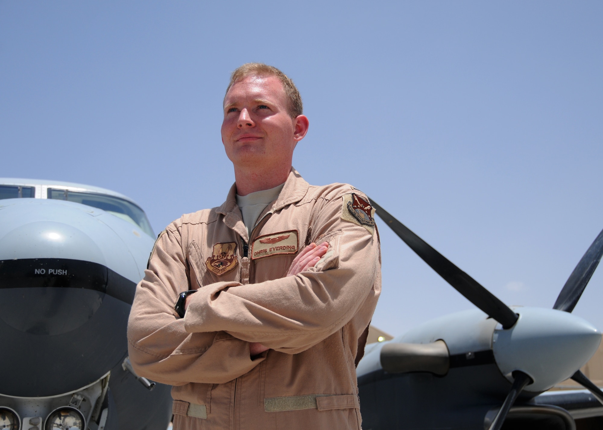 2nd. Lt. Christopher Everding, a 361st Expeditionary Reconnaissance Squadron MC-12W pilot, stands in front of the airplane he's about fly for a mission here at Kandahar Airfield, Afghanistan, June 8, 2012. Everding was recently awarded an Air Medal for flying more than 20 combat sorties in the area of responsibility. The MC-12W, a twin engine low to medium altitude aircraft, is mainly used for  intelligence, surveillance and reconaissance missions throughout the AOR. (U.S. Air Force photo/Staff Sgt. Heather Skinkle)