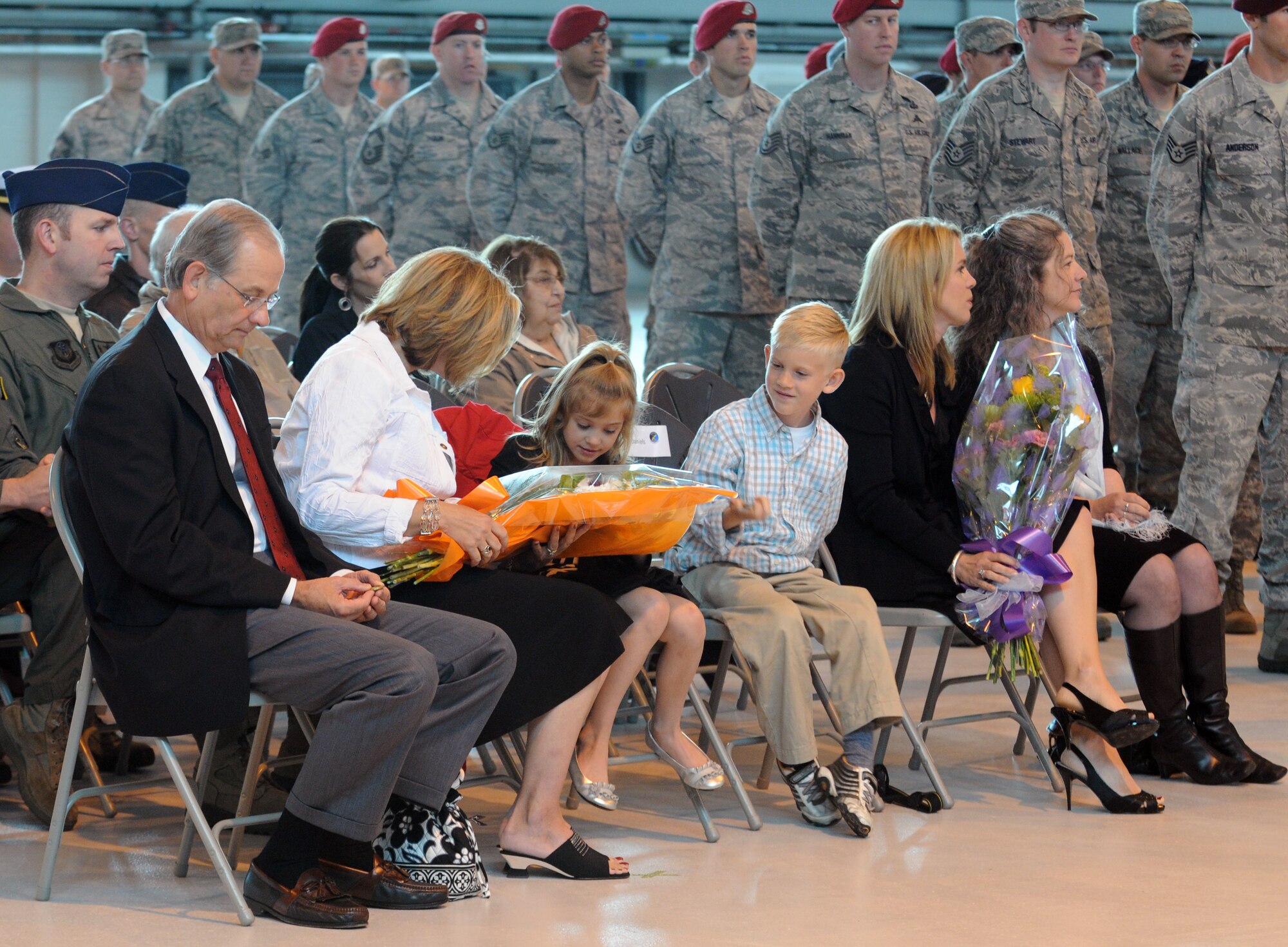 The family of Lt. Col. Jason Daniels, 321st Special Tactics Squadron commander, receives flowers and coins at the 321st STS change-of-command ceremony at RAF Mildenhall June 8, 2012. Daniels relinquished command and Maj. Travis Woodworth assumed command of the unit. (U.S. Air Force photo/Master Sgt. Kevin Wallace)