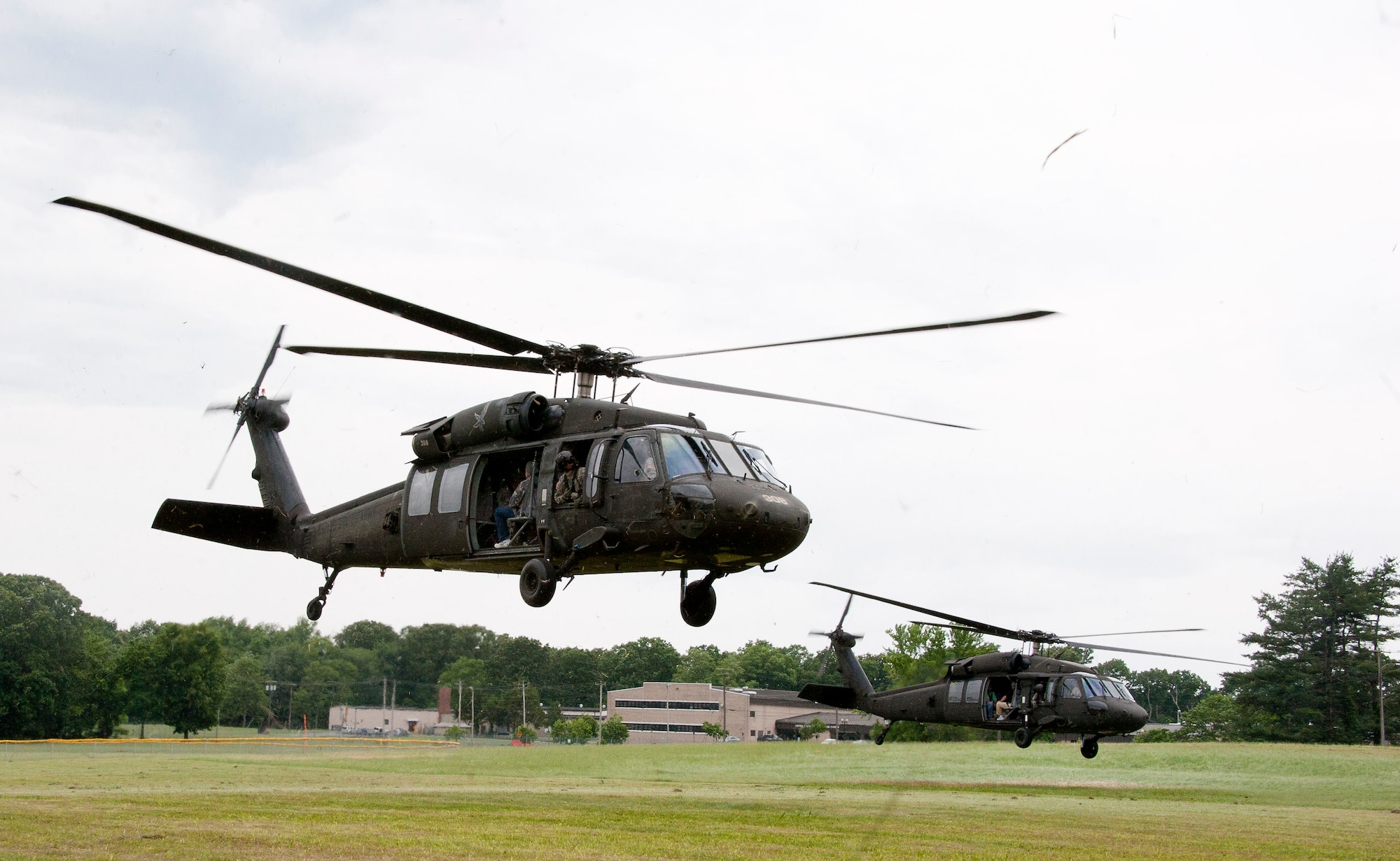 A group of UH-60 Black Hawks take off with a group of employers from the landing zone and head toward Range 59C during this year’s boss lift June 1. The reserve boss lift event, which was hosted by Army Support Activity, included a visit to the Army Reserve and National Guard Battle Lab, a ride on a UH-60 Black Hawk and a trip to the Dix firing ranges for a weapons demonstration. (U.S. Air Force photo by Airman 1st Class Ryan Throneberry/Released)