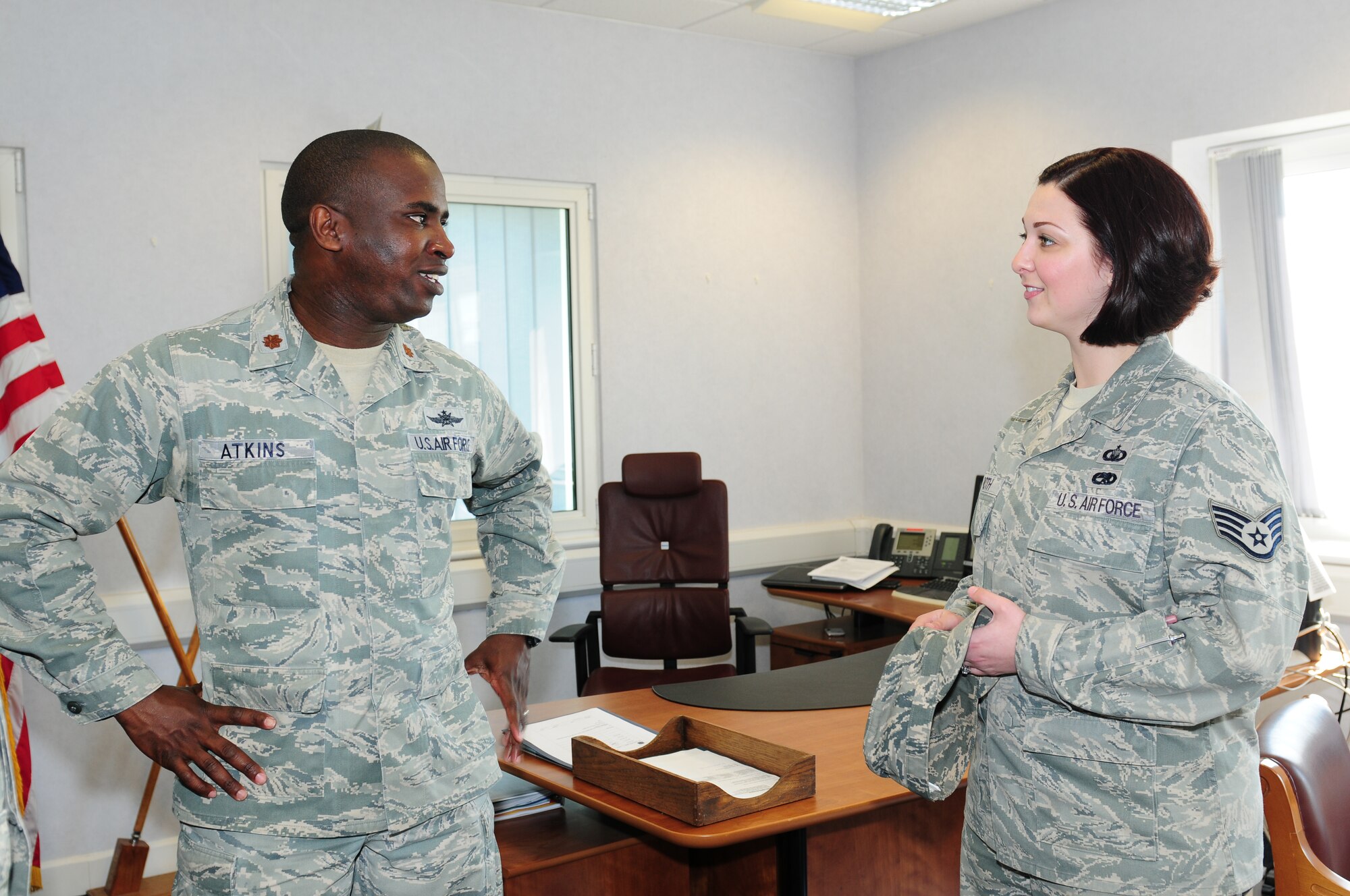 ROYAL AIR FORCE LAKENHEATH, England – Maj. Lamont Atkins, 48th Communications Squadron commander, speaks with Staff Sgt. Aimee Roth, 48th Fighter Wing chaplain assistant, during a visit from the chapel staff May 25, 2012. The RAF Lakenheath Chapel staff provides Airmen and their families with tools to help maintain spiritual readiness. (U.S. Air Force photo by Airman 1st Class Cory D. Payne)