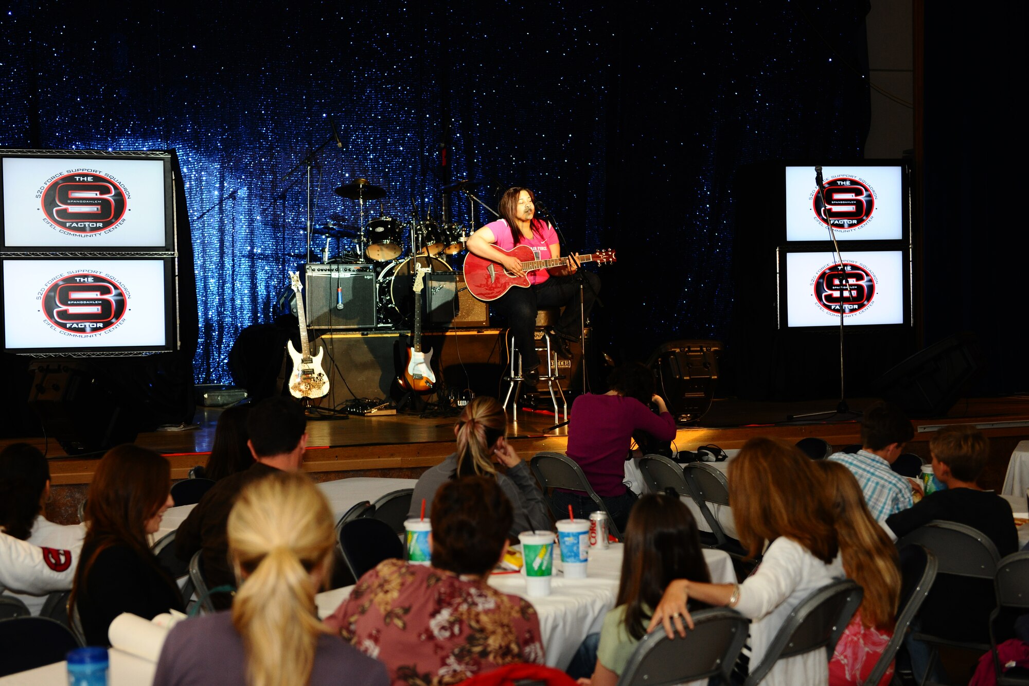 SPANGDAHLEM AIR BASE, Germany -- Diamond Muntean performs her rendition of "Solitude" by Evanescence during the first Spangdahlem Factor Talent Show at the Brick House here June 6. The 52nd Force Support Squadron-sponsored talent show showcased four local vocalists and three local bands competing in their respective categories for prize money. (U.S. Air Force photo by Airman 1st Class Dillon Davis/Released)