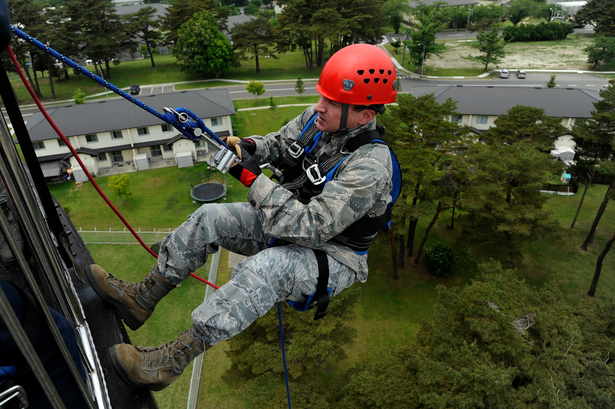 U.S. Air Force Col. Michael Rothstein, 35th Fighter Wing commander, prepares to rappel down the water tower at Misawa Air Base, Japan, June 8, 2012. Members of the 35th Civil Engineer Squadron fire department and explosive ordnance disposal flight use rappelling for confined space entry and emergency responses. (U.S. Air Force photo by Tech. Sgt. Marie Brown)

