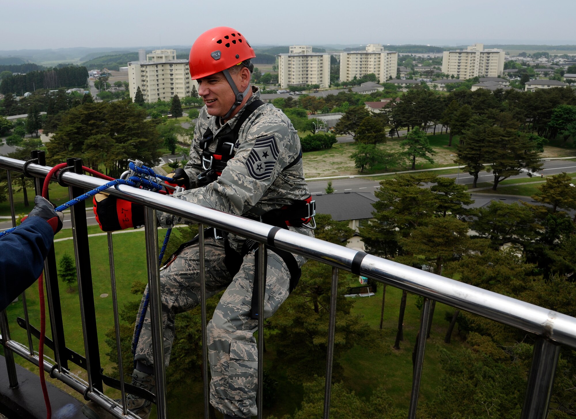 U.S. Air Force Chief Master Sgt. James Laurent, 35th Fighter Wing command chief, prepares to rappel down the Misawa water tower at Misawa Air Base, Japan, June 8, 2012. Airmen from the 35th Civil Engineer Squadron fire department gave instructions on proper rappelling techniques during their monthly warrior day training. (U.S. Air Force photo by Tech. Sgt. Marie Brown)