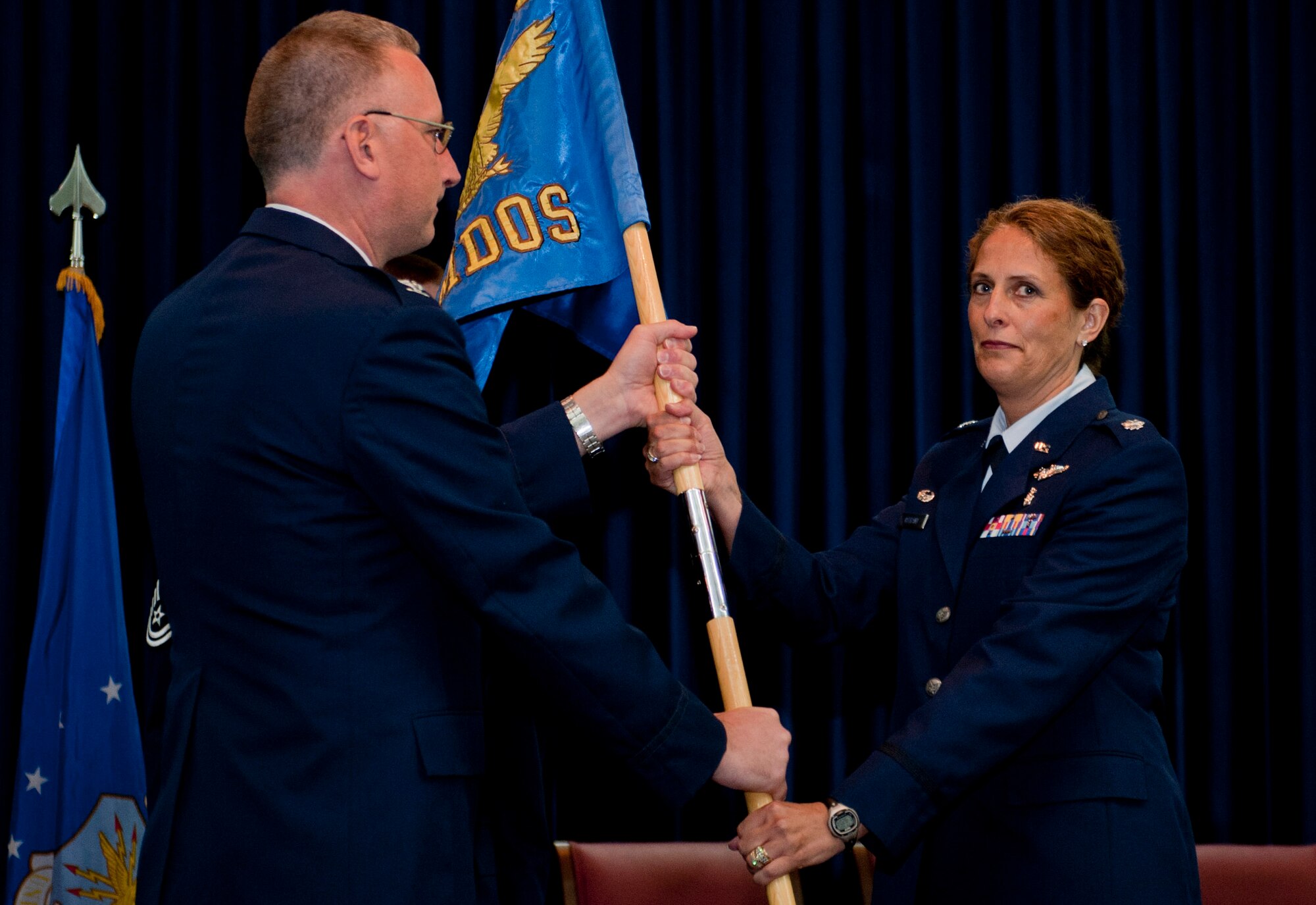 Lt. Col. Julie Ostrand, incoming 39th Medical Operations Squadron commander, accepts command of the 39th MDOS during the change-of-command ceremony June 8, 2012, at Incirlik Air Base, Turkey. Col. Jay Cloutier, 39th Medical Group commander, was the presiding officer for the ceremony. (U.S. Air Force photo by Senior Airman Anthony Sanchelli/Released) 
