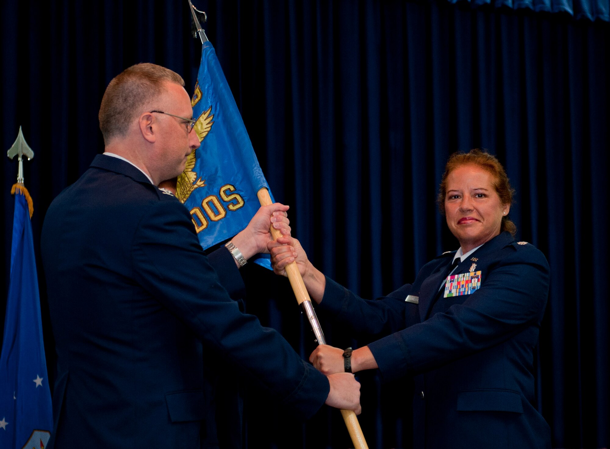 Lt. Col. Stephanie Buffett, outgoing 39th Medical Operations Squadron commander, relinquishes command of the 39th MDOS during the change-of-command ceremony June 8, 2012, at Incirlik Air Base, Turkey. Col. Jay Cloutier, 39th Medical Group commander, was the presiding officer for the ceremony. (U.S. Air Force photo by Senior Airman Anthony Sanchelli/Released) 
