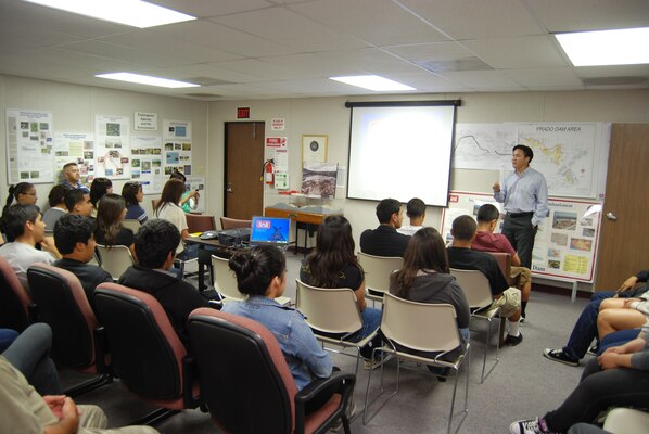CORONA, Calif. — Michael Siu, the senior civil engineer at Prado Dam in Corona, Calif., welcomes math, science and technology students from Roosevelt High School to the dam June 4 to learn its purpose and benefits and why the dam was constructed at that location. 