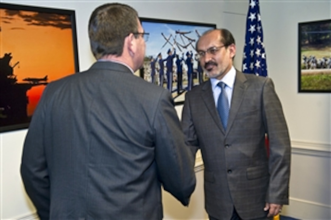 Deputy Defense Secretary Ashton B. Carter, left, shakes hands with Enayatullah Nazari, Afghanistan's first deputy defense minister, at the Pentagon, June 8, 2012.