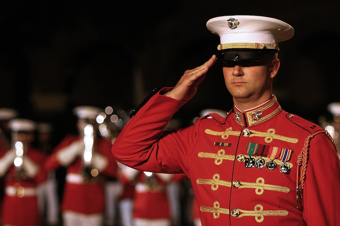 Chief Warrant Officer James Foley, U.S. Marine Drum & Bugle Corps operations officer, salutes during a Friday Evening Parade at Marine Barracks Washington June 8.::r::::n::::r::::n::