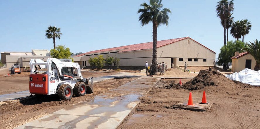 The 163d Civil Engineering Squadron teamed up with Navy Seabee reservists to work with Tony Alves, a local architect, on a low water and low maintenance base beautification landscaping project. The two units partnered together for the base Xeriscaping project as a part of their drill status May 3- 6. The Navy reservists drill with the 163d CE squadron for the opportunity to train on equipment they do not normally have a chance to use. As the Seabees train, the 163d Reconnaissance Wing receives labor in exchange. The Xeriscaping project they teamed up to work on includes a drip system which will reduce the need for supplemental water from irrigation and will require less maintenance. CAL FIRE rehabilitation work crews are also being used to help with the project. (U.S. Air Force photo by Master Sgt. Julie Avey)
