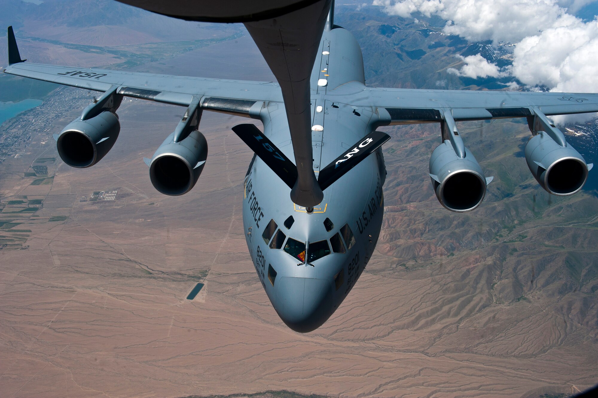 A C-17 Globemaster III demonstrates aerial refueling capabilities from a KC-135 Stratotanker during an aeriel refueling demonstration over Kyrgzystan June 8, 2012. A KC-135 can hold up to 83,000 lbs of fuel in a single mission. (U.S. Air Force photo/Senior Airman Brett Clashman)