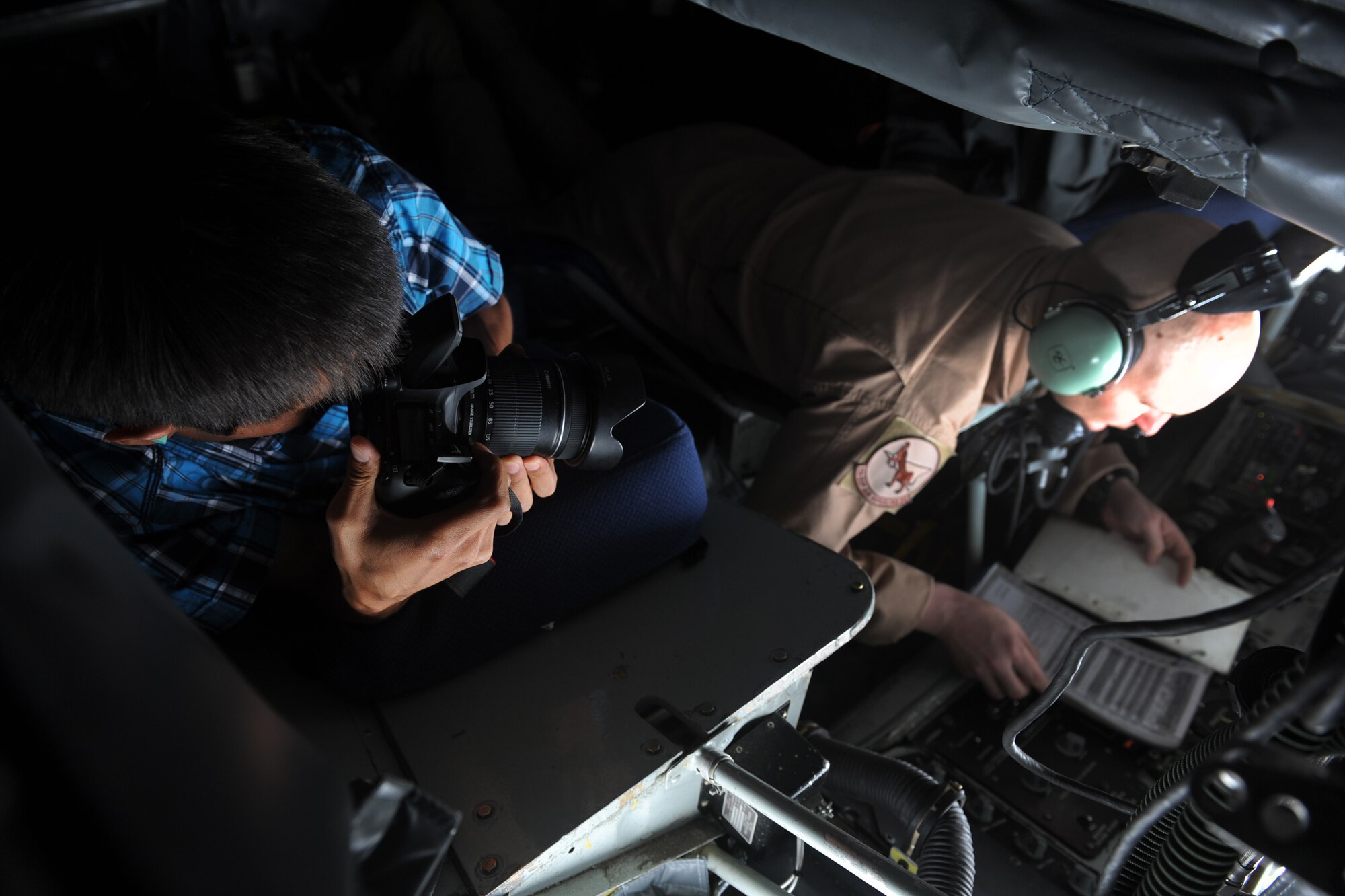 Janarbek Djoldoshbaev documents Senior Airman Ricky Warren during an aerial refueling capabilities demonstration over Kyrgyzstan, June 8, 2012. Djoldoshbaev is a camerman with the Azattyk Broadcasting Company and Barros is a boom operator with the 22nd Expeditionary Air Refueling Squadron deployed out of Fairchild Air Force Base and is a native of Enon, Okla. (U.S. Air Force photo/Senior Airman Brett Clashman)