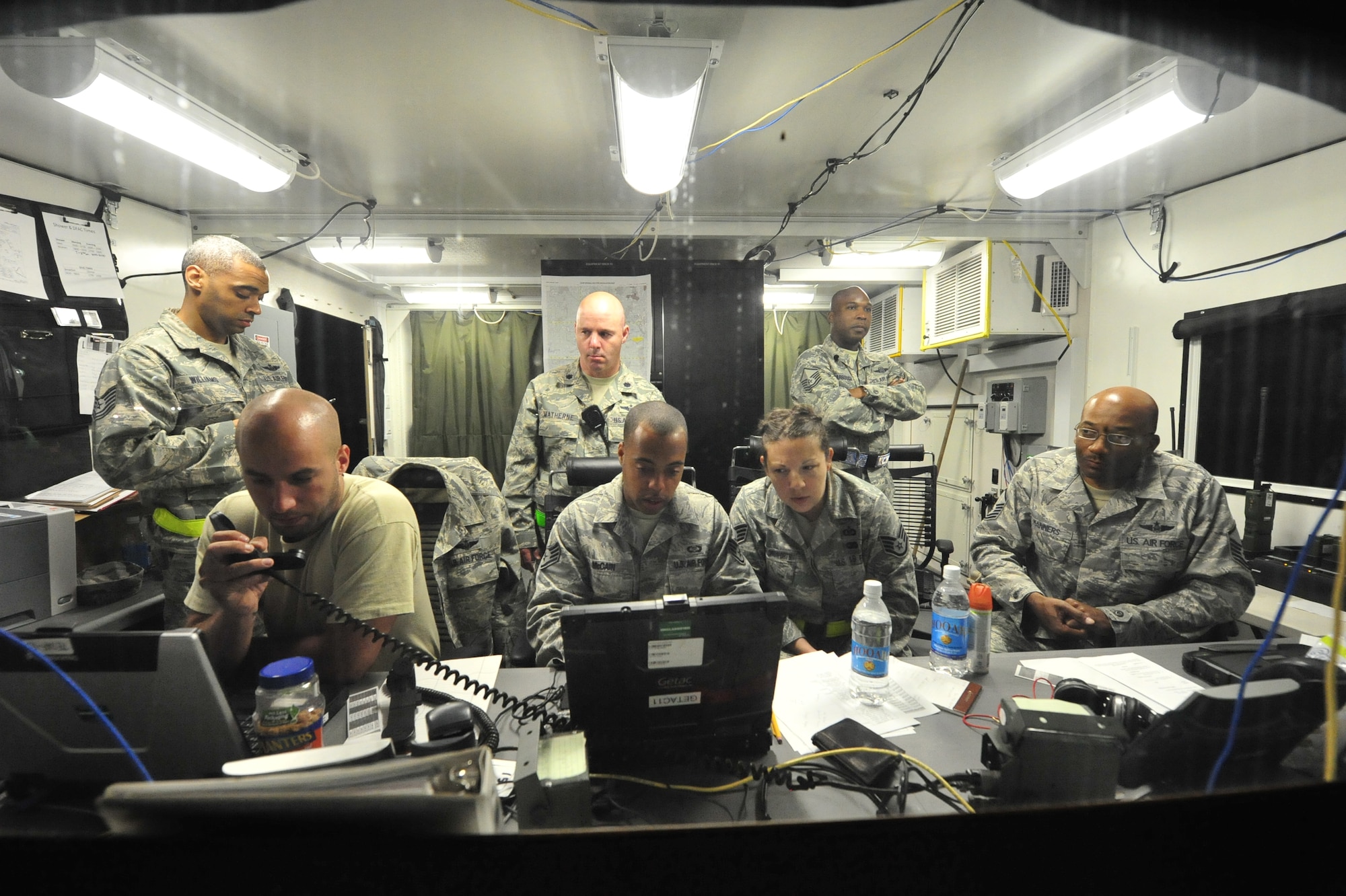 Airmen from the 621st Contingency Response Wing, stationed at Joint Base McGuire-Dix-Lakehurst, N.J. provide air mobility and logistics support at Mackall Army Airfield, N.C. during Joint Operational Access Exercise 12-02, June 3. JOAX is a two-week forcible entry and ground combat exercise to prepare Air Force and Army service members to respond to worldwide crises and contingencies. (U.S. Air Force photo by Tech. Sgt. Parker Gyokeres)