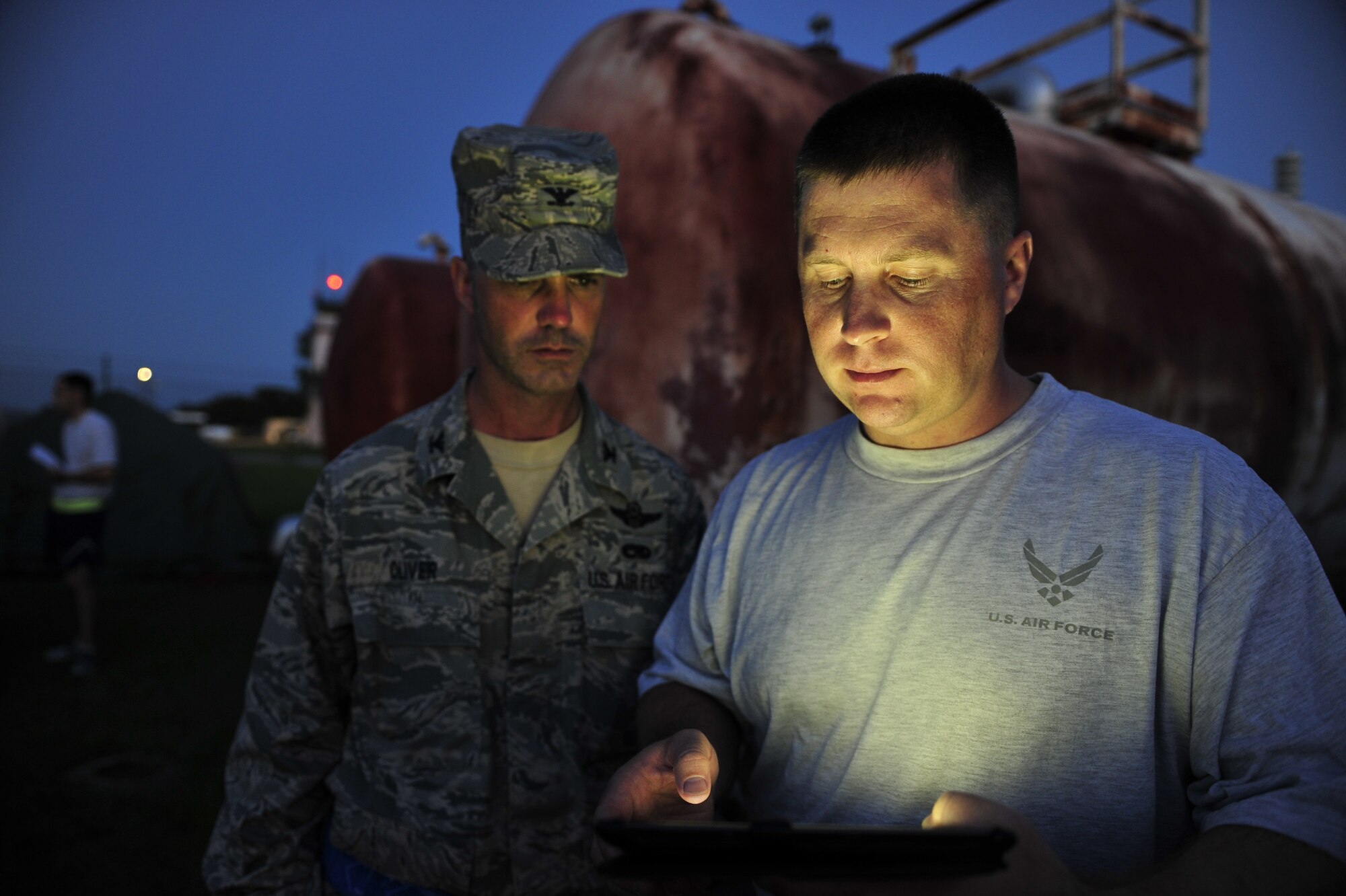 Col. Kevin Oliver, Joint Task Force - Port Opening commander, and Lt. Col. Shawn Underwood, 621st Contingency Response Wing exercise evaluator, check a mission timeline June 2, 2012, during support for Joint Operational Access Excercise 12-02 at Mackall Army Airfield, N.C.. Both are assigned to the 621st CRW at Joint Base McGuire-Dix-Lakehurst, N.J. (U.S. Air Force photo by Tech. Sgt. Parker Gyokeres)