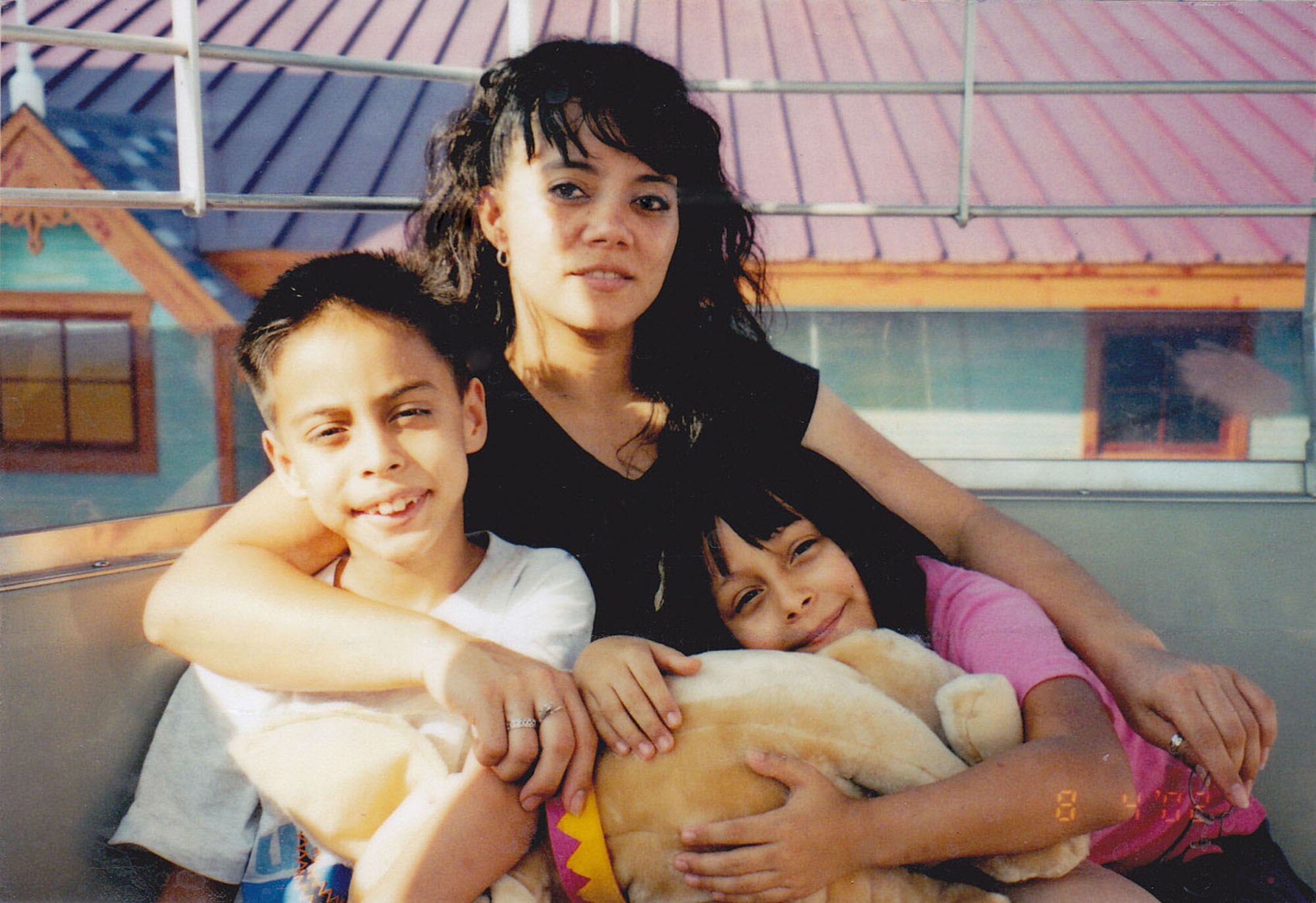 Jerry, as a pre-teen, shares a happy moment with his mom, Melanie, and his sister, Myya, who was with him at the lake. (Courtesy Photo)