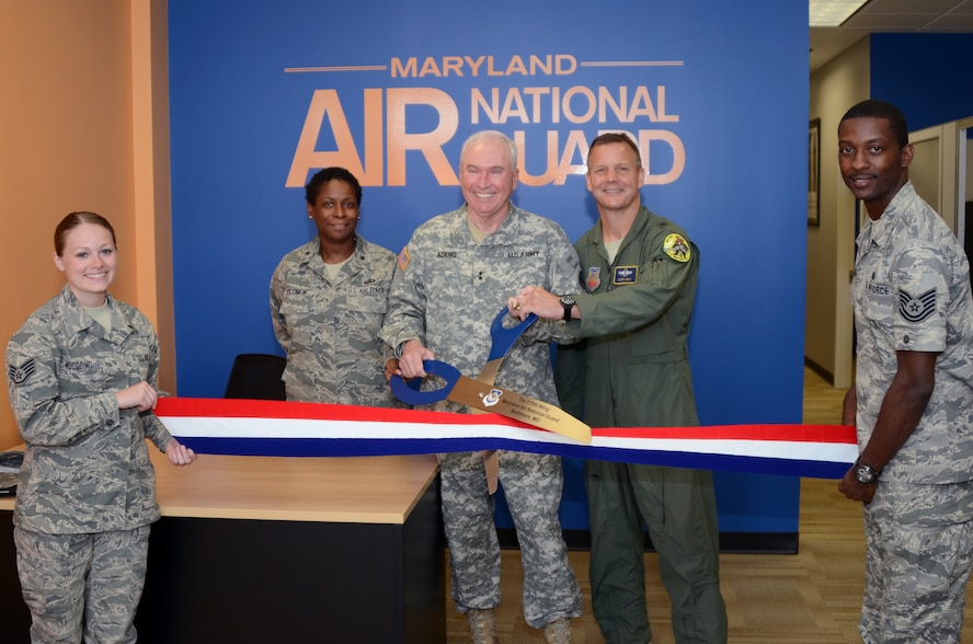 U.S. Army Maj. Gen. James A. Adkins, Adjutant General, Maryland National Guard, along with U.S. Air Force Brig. Gen. Allyson R. Solomon, Assistant Adjutant General-Air, and Brig. Gen. Scott Kelly, 175th Wing Commander, cut the ribbon of the new Air National Guard recruiting storefront in Baltimore, Md., on June 9, 2012, while recruiters Staff Sgt. Alexanderia Woodring and Tech Sgt. Robert Carr hold on. (National Guard photo by Staff Sgt. Benjamin Hughes) 
