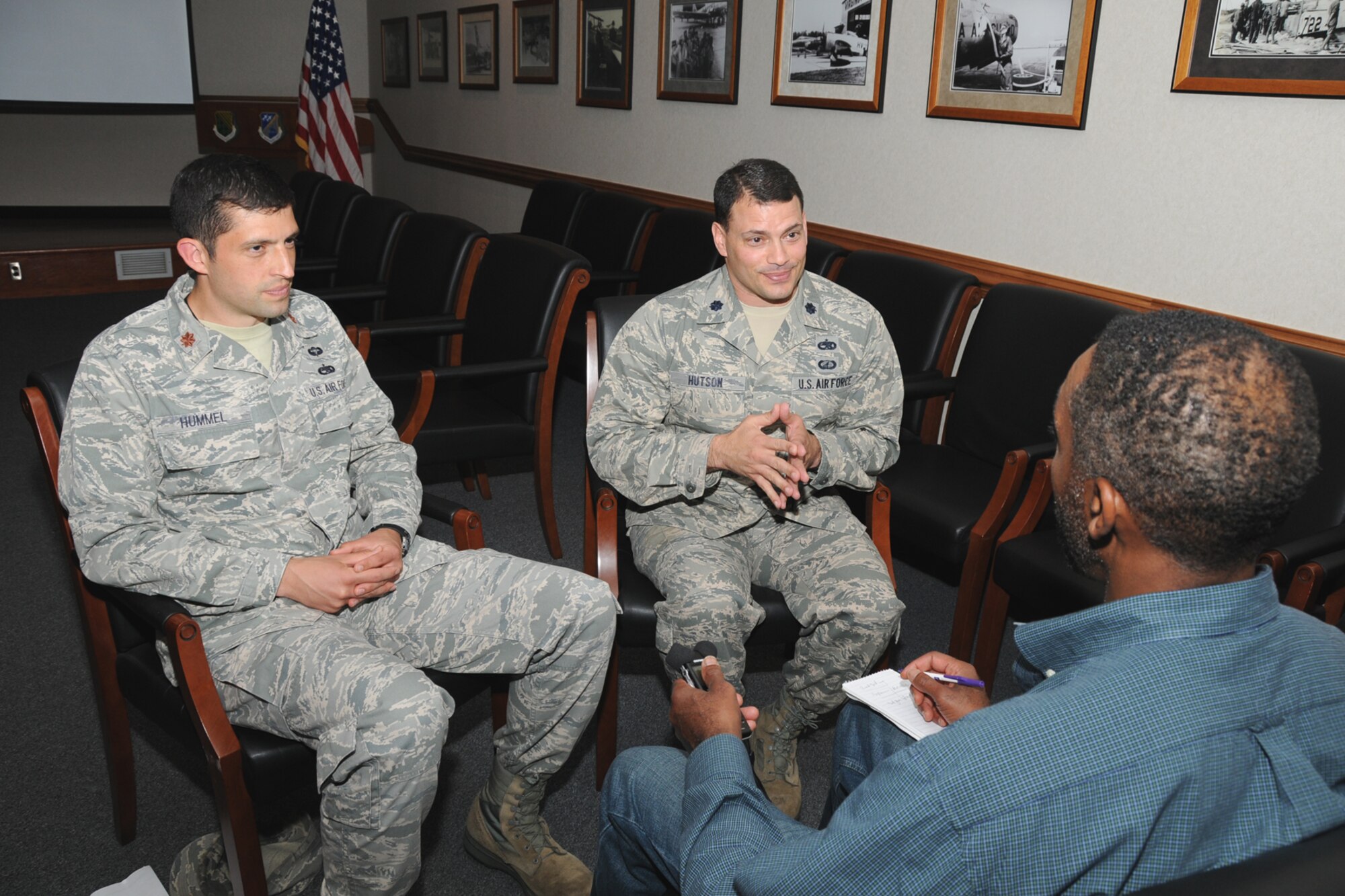 Maj. Matthew Hummel (left), 192nd Fighter Wing Aircraft Maintenance Operations Officer, and Lt. Col. Gregory Hutson, 1st Fighter Wing Maintenance Group Deputy Commander, are interviewed by J.J. Green, a National Security Advisor for 103.5 FM, WTOP radio, May 22, 2012 at Langley Air Force Base, Va.  The news and talk station based out of Washington, D.C., will focus their interview on the mission, people, assets and life of the base.  The week-long program is scheduled to air in July.  (National Guard photo by Master Sgt. Carlos J.
Claudio/Released)
