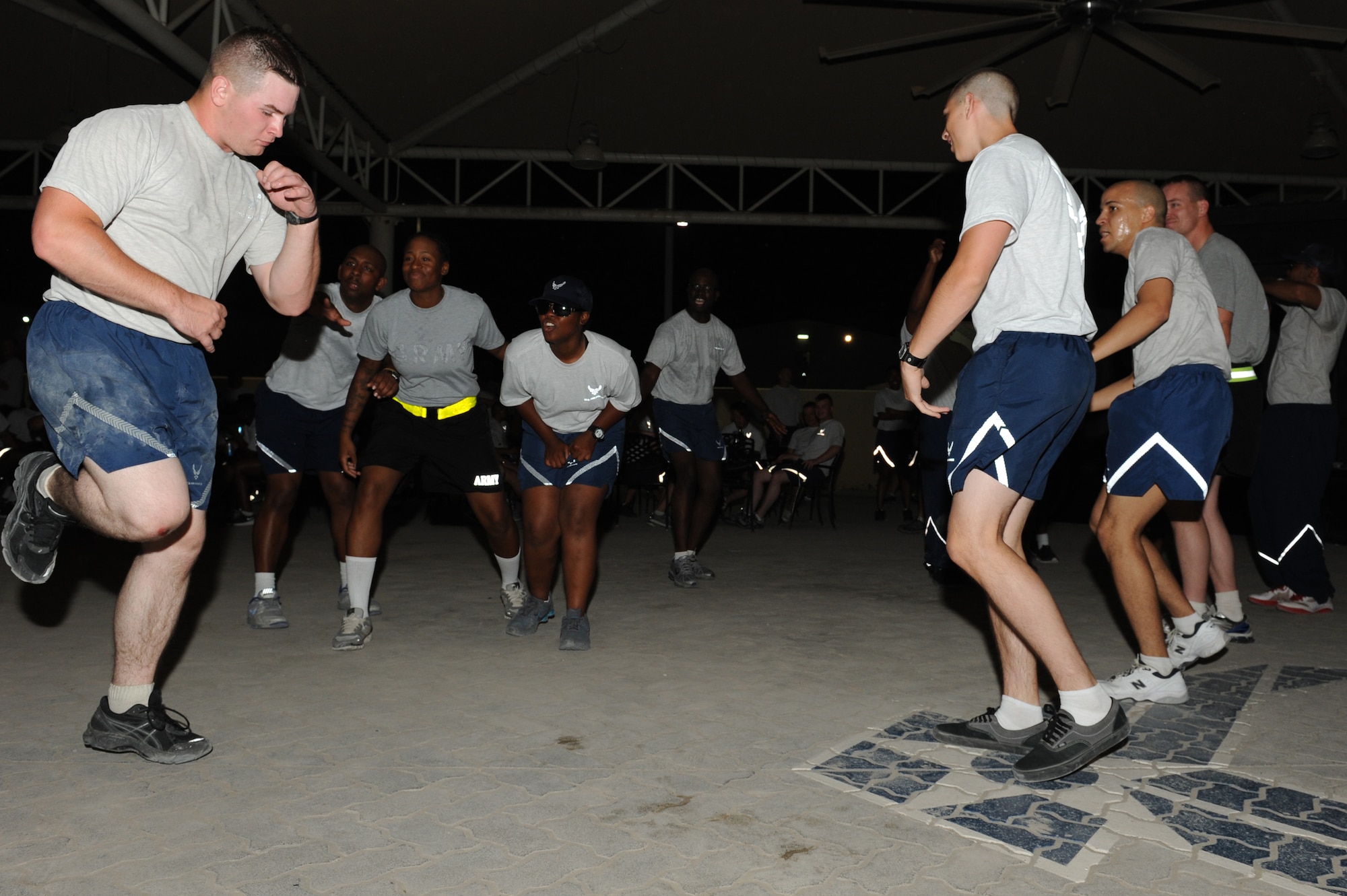 SOUTHWEST ASIA -  Airmen and Soldiers dance during a performance by DJ VH1, Lady Gaga's disc jockey,  at the 380th Air Expeditionary Wing Pavilion June 9, 2012. The 380th Expeditionary Force Support Squadron set up the show to boost the morale of the troops. (U.S. Air Force photo/Master Sgt. Scott MacKay)