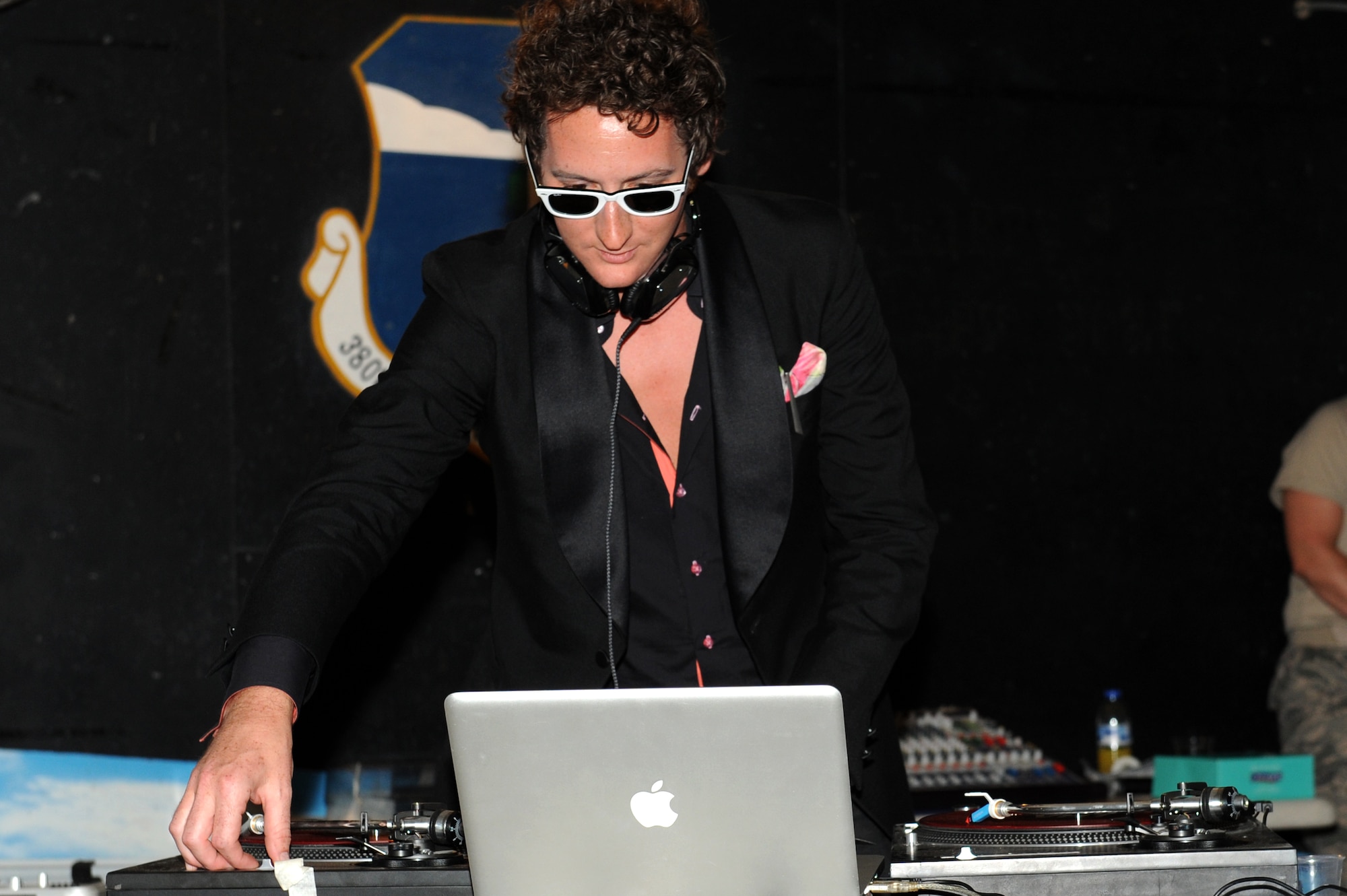 SOUTHWEST ASIA - DJ VH 1, Lady Gaga's disc jockey, performs for Airmen and Soldiers at the 380th Air Expeditionary Wing Pavilion June 9, 2012. The 380th Expeditionary Force Support Squadron set up the show to boost the morale of the troops. (U.S. Air Force photo/Master Sgt. Scott MacKay)
