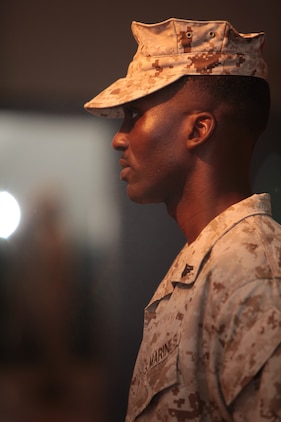 Cpl. James K. Spencer, an operations chief with Marine Corps University, Marine Corps Base Quantico, Va., and Fayetteville, N.C., native, demonstrates standard commands, such as attention and parade rest, during a National Museum of the Marine Corps educational outreach program at the John A. Polonye Community Center in Brook Park, Ohio, June 11. The program, part of Marine Week Cleveland June 11-17, featured a puppet show and a presentation by Marines in various time-period uniforms.