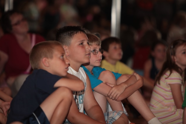 A crowd of children watch a puppet show during an educational outreach program put on by the National Museum of the Marine Corps at the John A. Polonye Community Center in Brook Park, Ohio, June 11. In addition to a puppet show about Marine Corps knowledge and traditions, children were introduced to Marine Corps uniforms worn throughout the ages. The event is scheduled to run Monday through Friday at 2 p.m. during Marine Week Cleveland, June 11-17.
