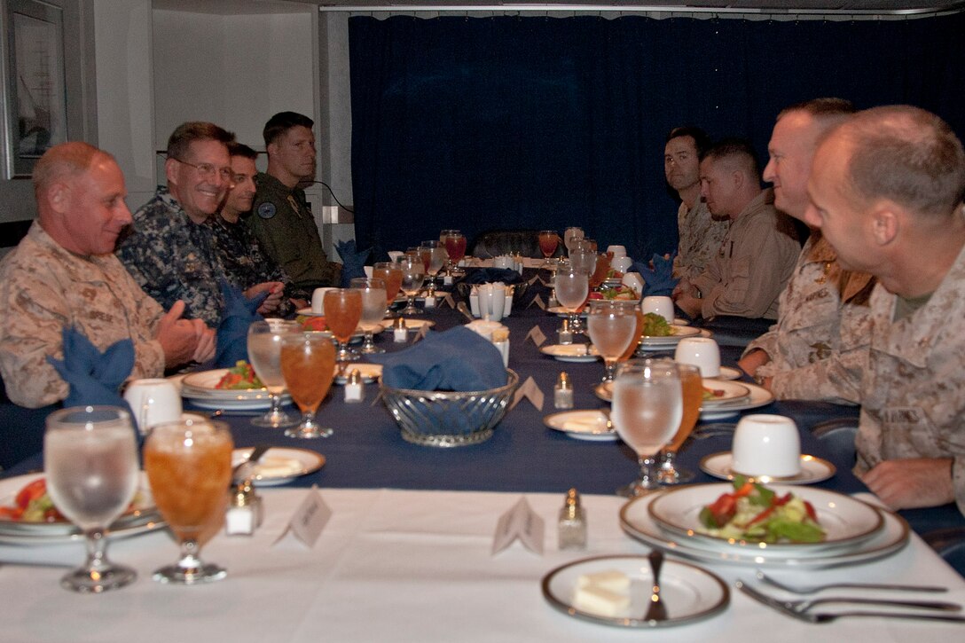 Maj. Gen. Melvin G. Spiese, deputy commanding general, I Marine Expeditionary Force, sits in the flag mess aboard the USS Peleliu with officers of I MEF, the 15th Marine Expeditionary Unit, and Amphibious Squadron Three, June 10.  Spiese came on board to observe a portion of PHIBRON-MEU Interoperability Training, a two-week exercise which allows the sailors and Marines of the Peleliu Amphibious Ready Group and 15th MEU to work together for the first time as a blue-green team