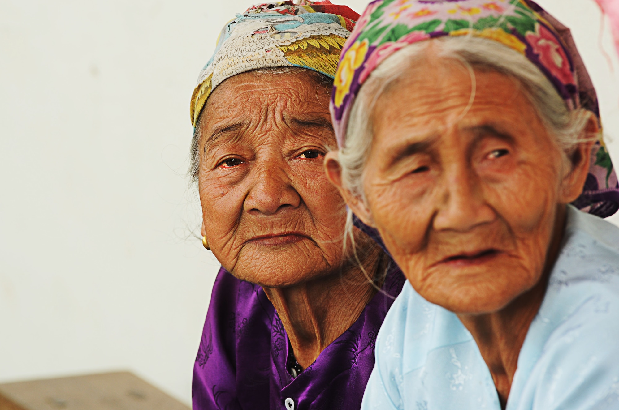 Two Vietnamese women wait to be seen by U.S. military doctors at the Xuan Lam Primary School in Nghe An Province, Vietnam, June 11 during Pacific Angel-Vietnam 2012. The locations for the engagement were designated by the host nation government and armed forces based on needs in the communities that PACANGEL can help. Operation Pacific Angel gives the U.S. an opportunity to support the efforts of other governments in the Pacific  region by providing medical, dental, optometry and engineering assistance to the host nation citizens. (U.S. Air Force photo/Senior Airman Lauren Main)