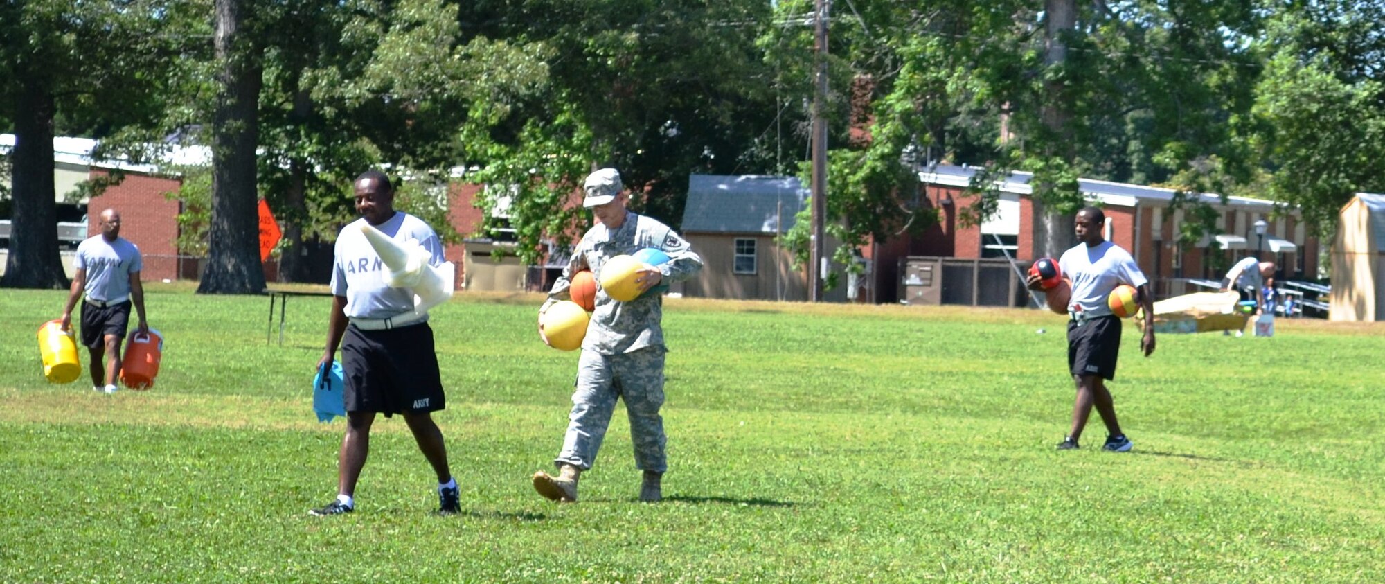 Soldiers from the 7th Sustainment Brigade here, put away games and activities during General Stanford Elementary School's field day at Ft. Eustis, Va., June 7, 2012. The school has a field day at the end of each school year to allow the students a chance to enjoy themselves, stay active and encourage physical fitness. (U.S. Army photo by Spc. Ondirae H. Abdullah-Robinson/Released)