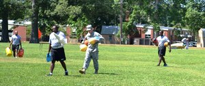 Soldiers from the 7th Sustainment Brigade here, put away games and activities during General Stanford Elementary School's field day at Ft. Eustis, Va., June 7, 2012. The school has a field day at the end of each school year to allow the students a chance to enjoy themselves, stay active and encourage physical fitness. (U.S. Army photo by Spc. Ondirae H. Abdullah-Robinson/Released)