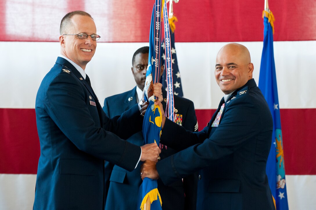 Col. Thomas Goulter (right) accepts command of the 28th Mission Support Group from Col. Mark Weatherington, 28th Bomb Wing commander, during a change of command ceremony on Ellsworth Air Force Base, S.D., June 8, 2012. Goulter is now responsible for the six squadrons that make up the 28th MSG and provides essential services for active-duty members, retirees and civilians and their families, including food services, security, vehicles, supplies, communications support, civil engineering, personnel support and educational and recreational services. (U.S. Air Force photo by Airman 1st Class Kate Thornton/Released)